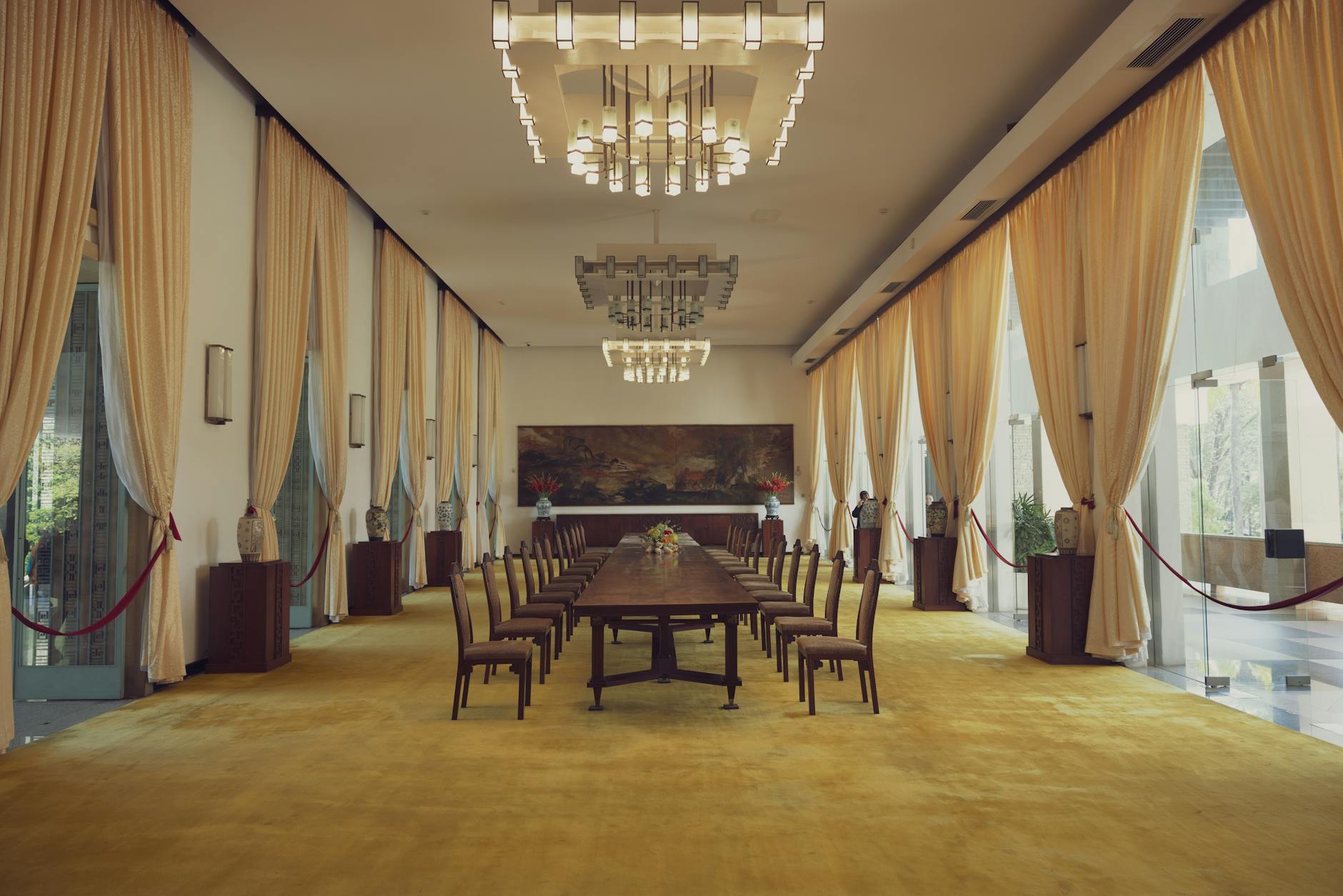 Representatives at diplomatic negotiation table with national flags