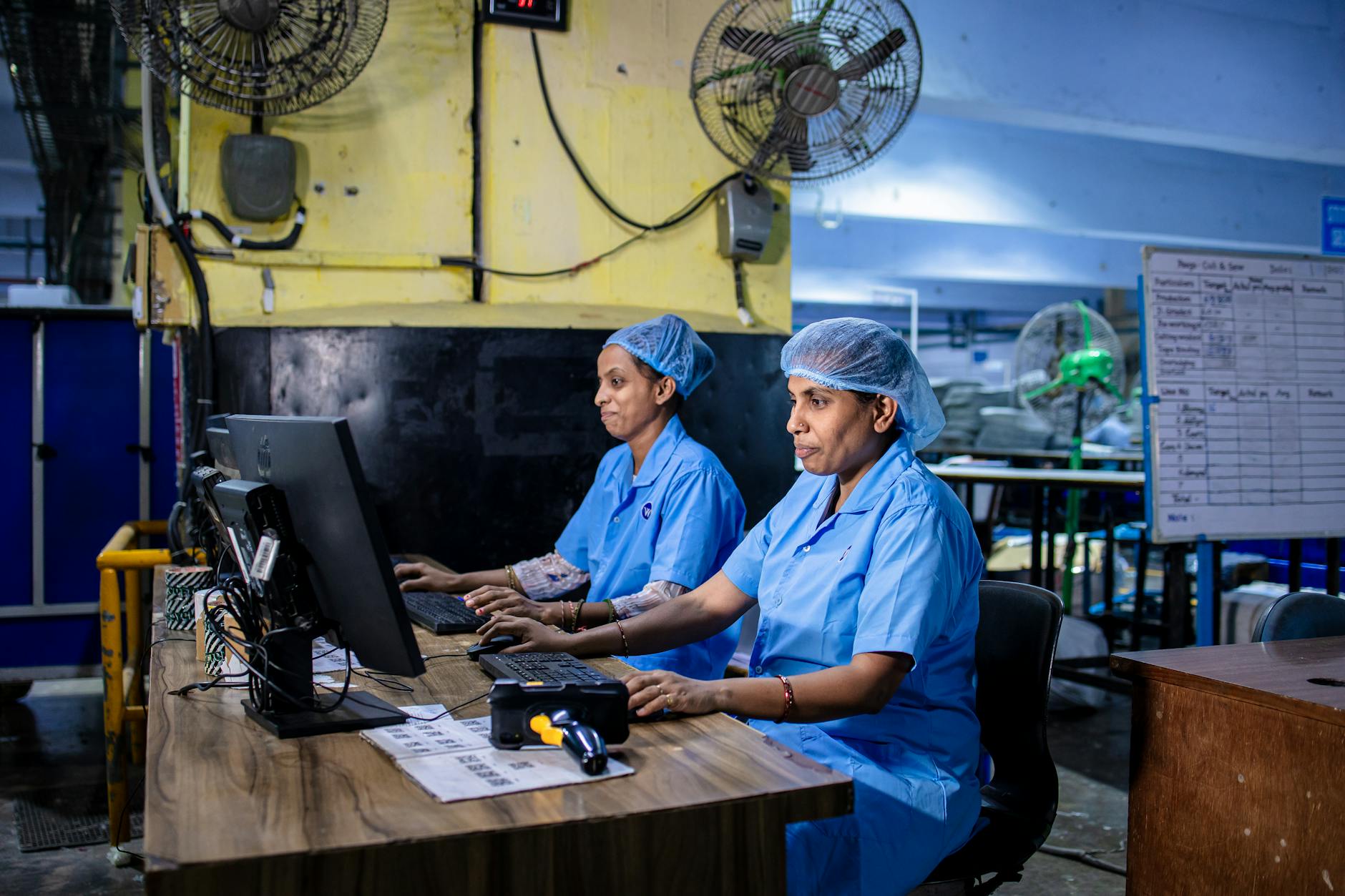 Manufacturing workers in industrial setting representing automotive production workforce