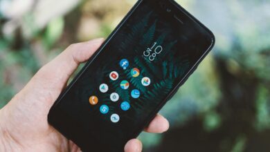 Person using smartphone showing social media interface and engagement metrics