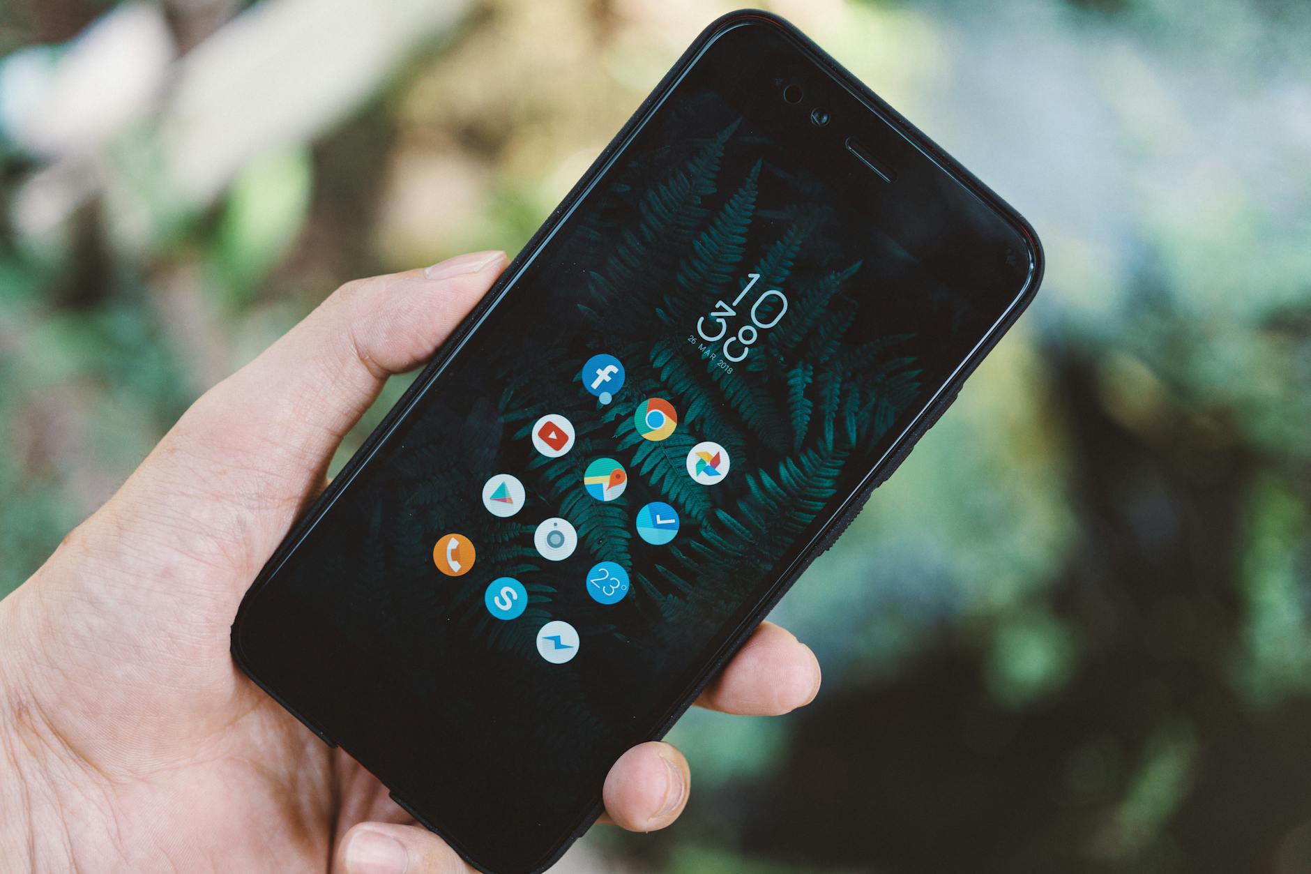 Person using smartphone showing social media interface and engagement metrics