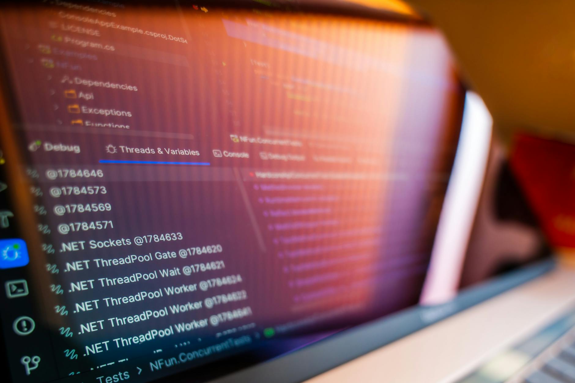 Multiple computer monitors displaying banking system interfaces and security alerts