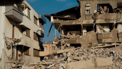 Damaged building structure showing cracks and debris from seismic activity