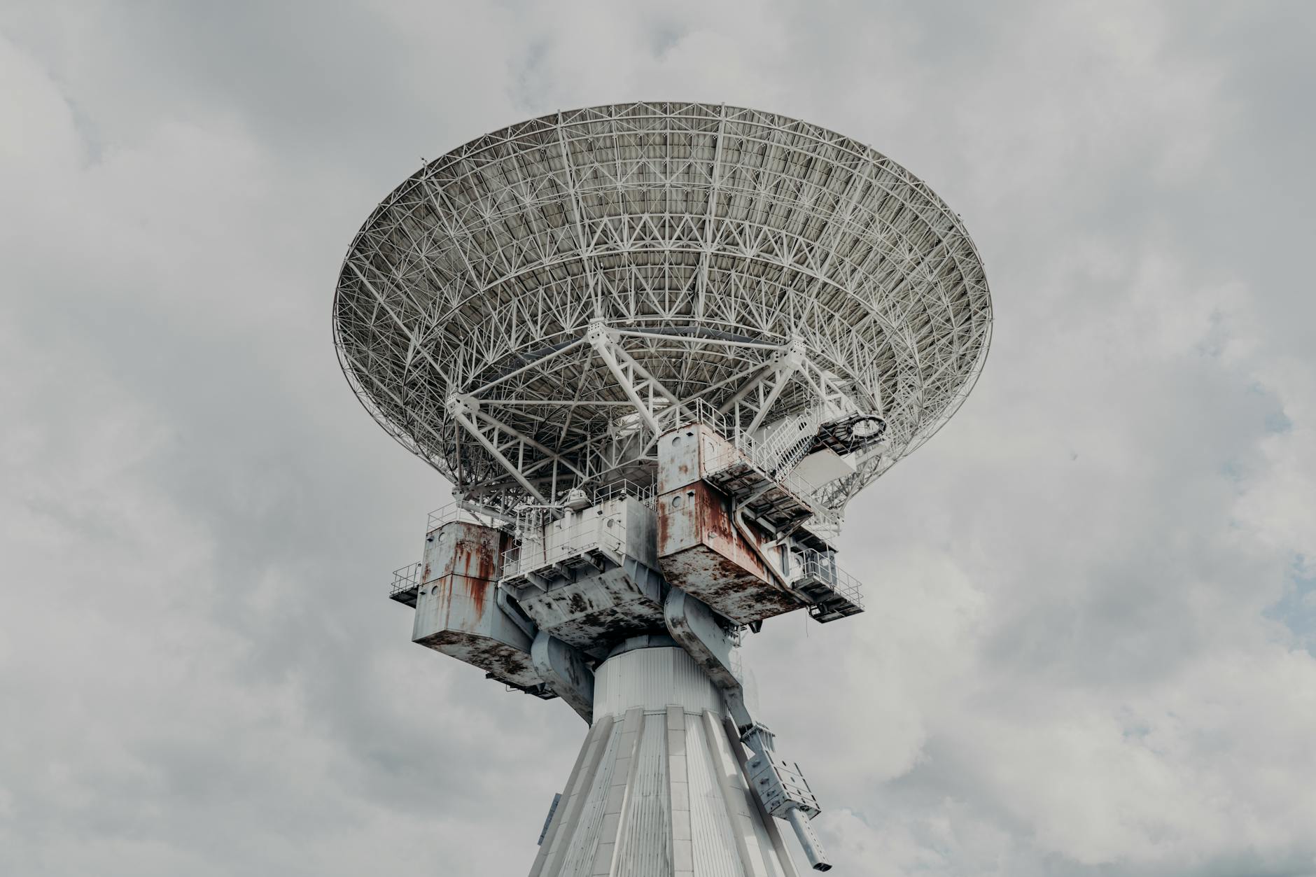 Large satellite dish pointing toward sky for space communications
