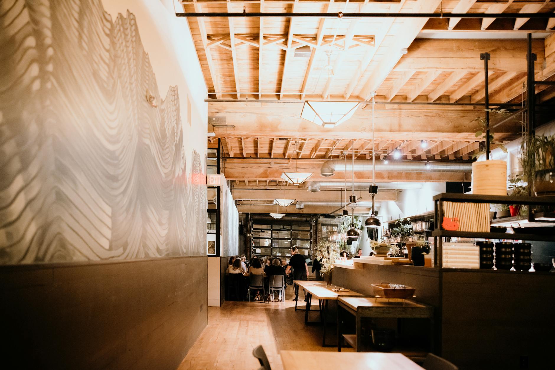 Modern fast-food restaurant interior with customers dining and menu displays visible