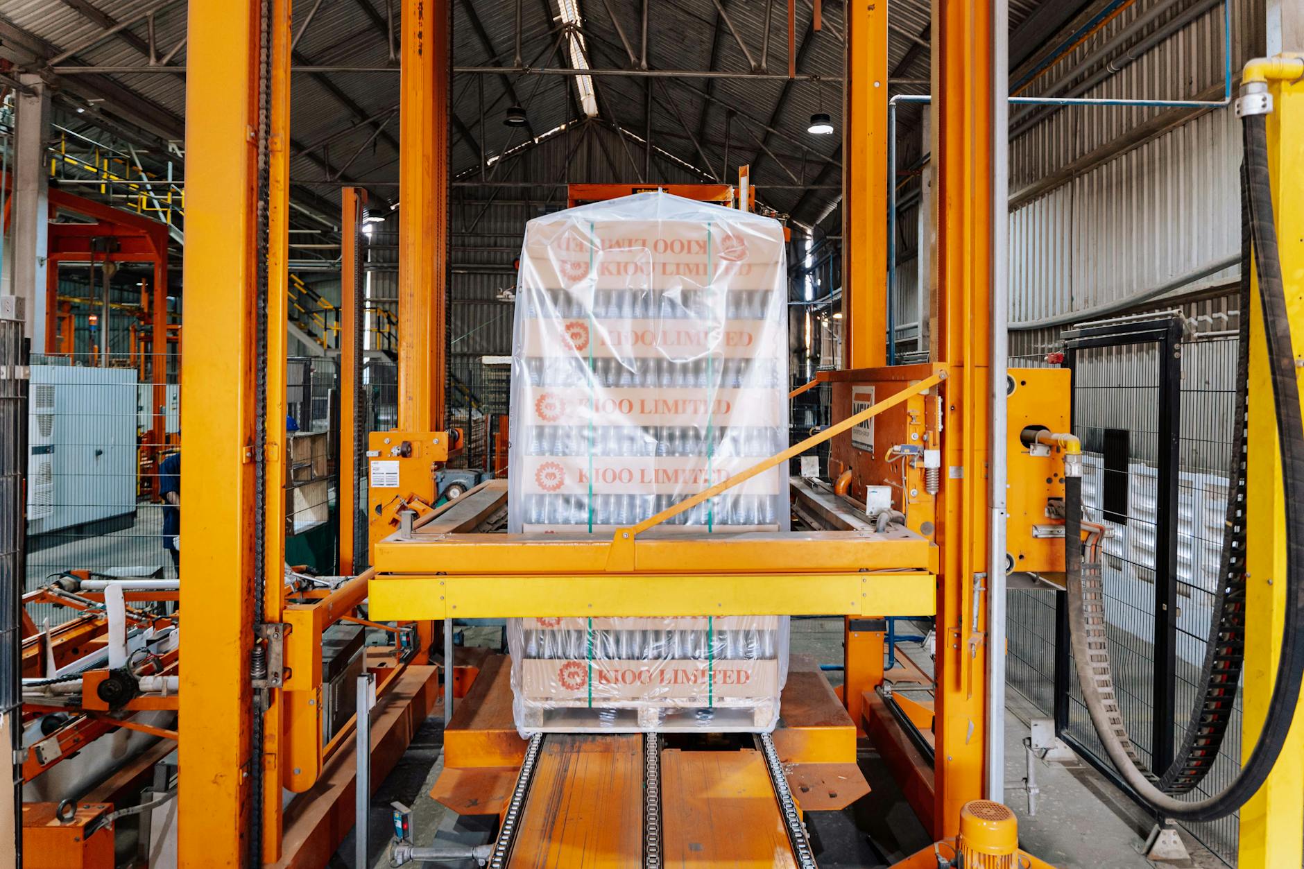Modern automated warehouse facility with conveyor systems and robotics