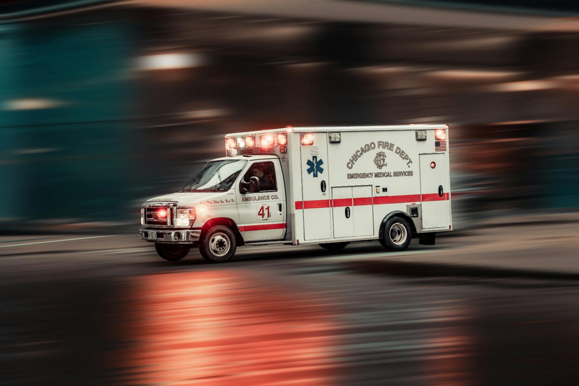 Emergency response vehicles with flashing lights at disaster scene