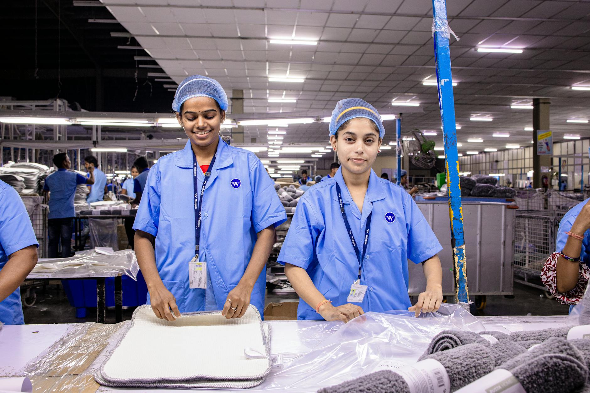 Manufacturing workers in safety equipment at industrial facility