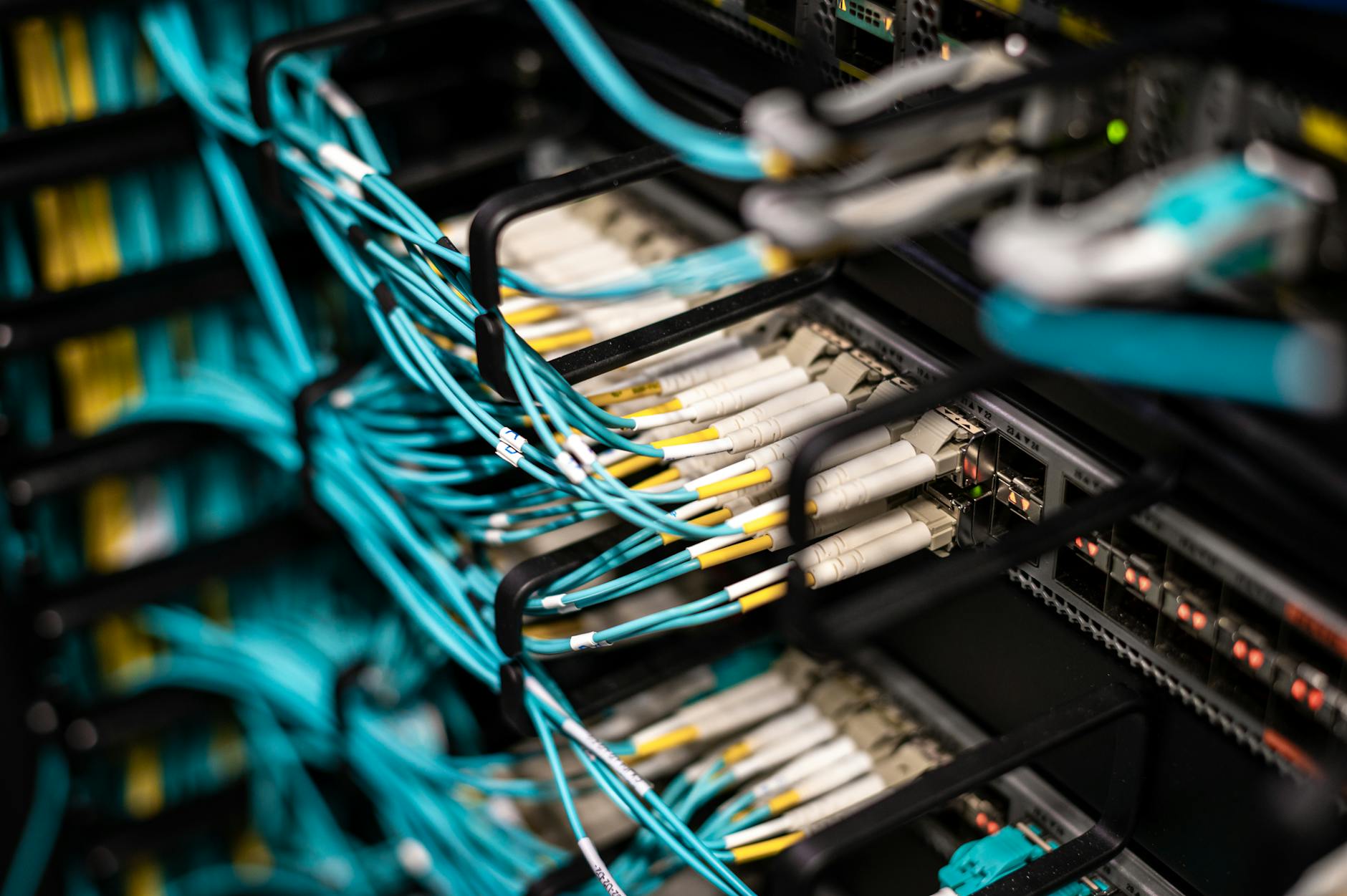 Close-up view of network infrastructure and server cables in data center