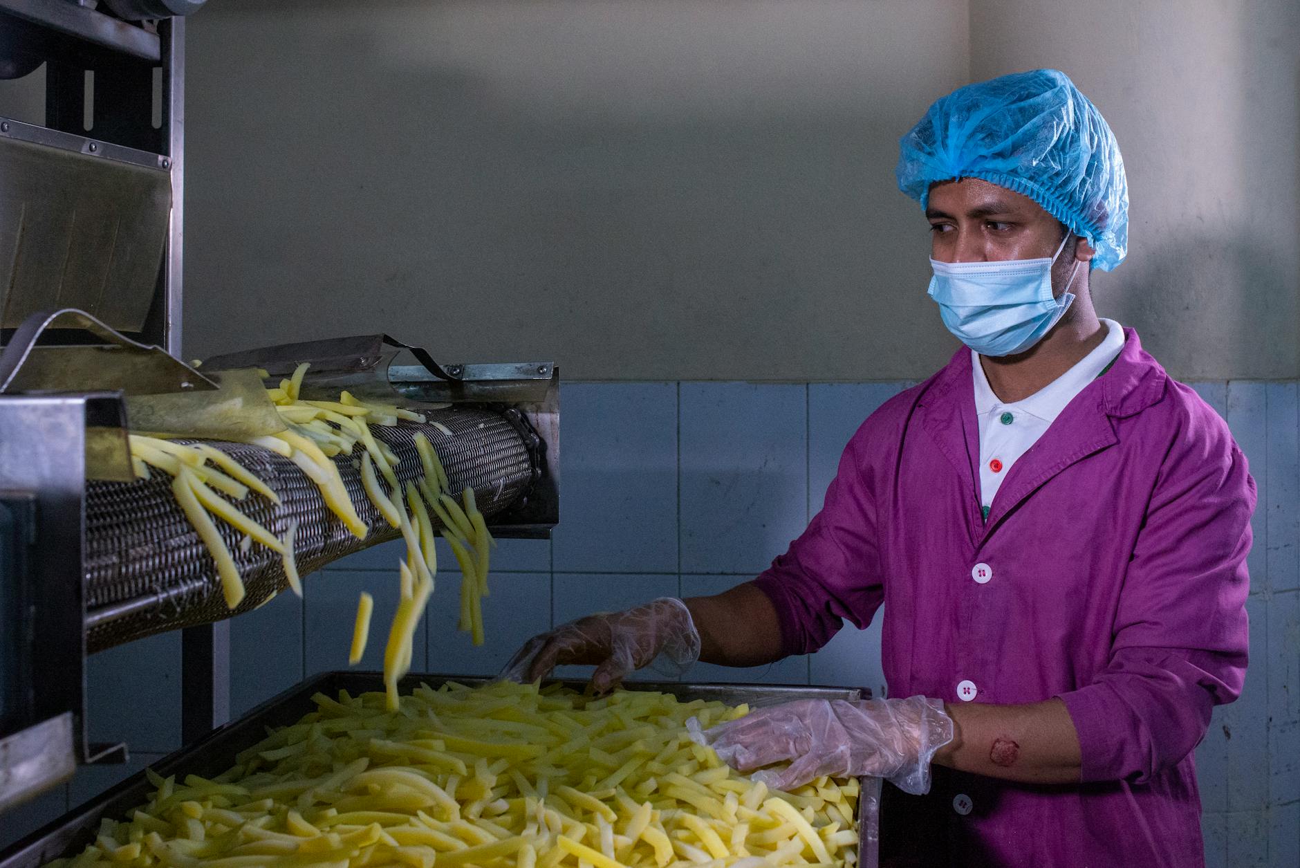 Food manufacturing facility showing production line equipment and quality control processes