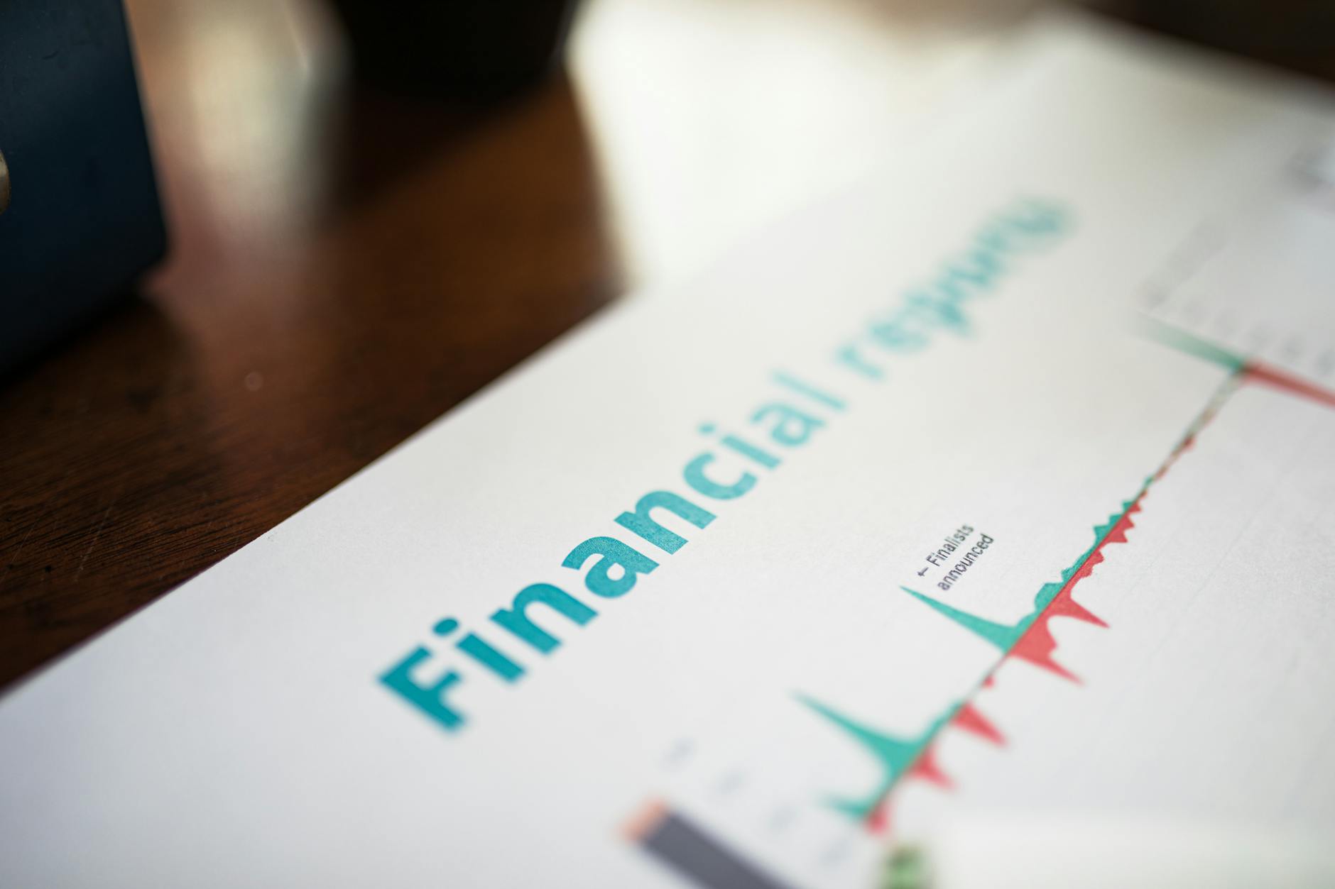 Person reviewing financial paperwork and loan documents at desk