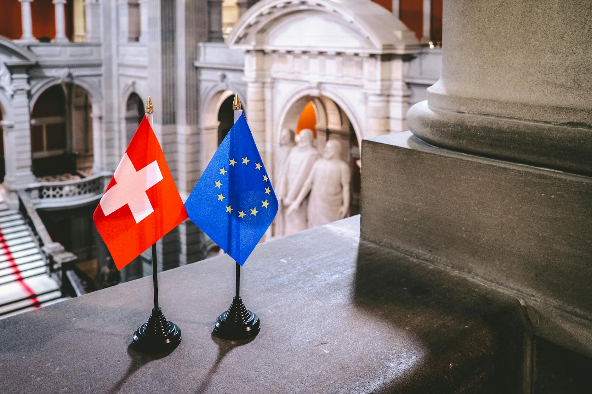 Multiple European flags displayed together symbolizing regional cooperation and partnership