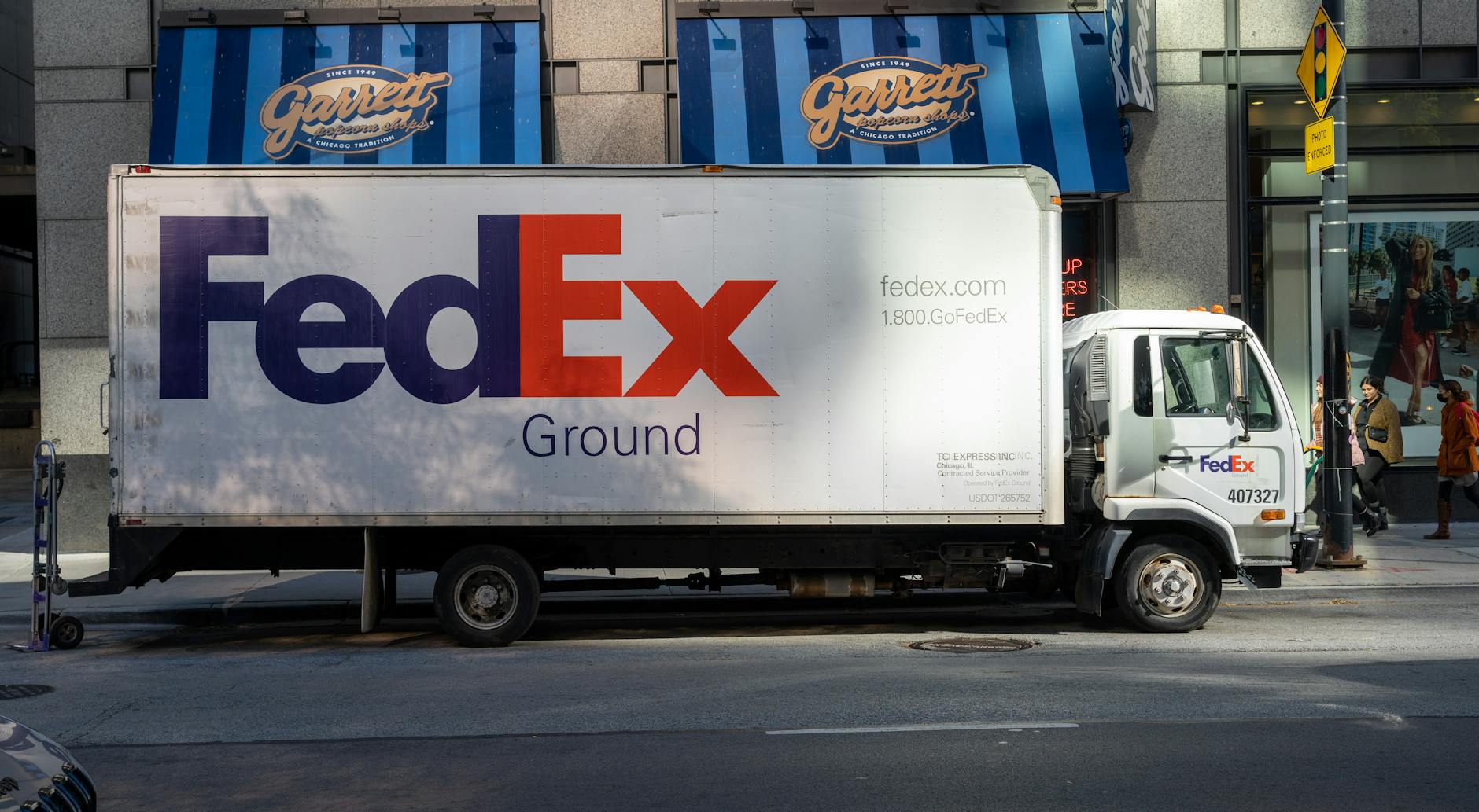 White delivery truck on suburban street for last-mile grocery delivery