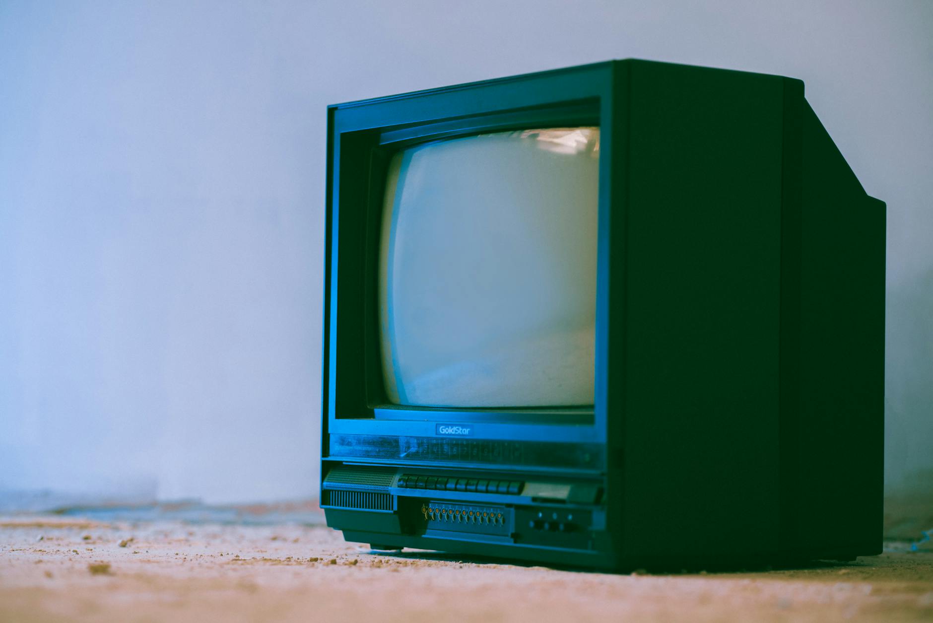 Large television display showing streaming platform interface with multiple content options