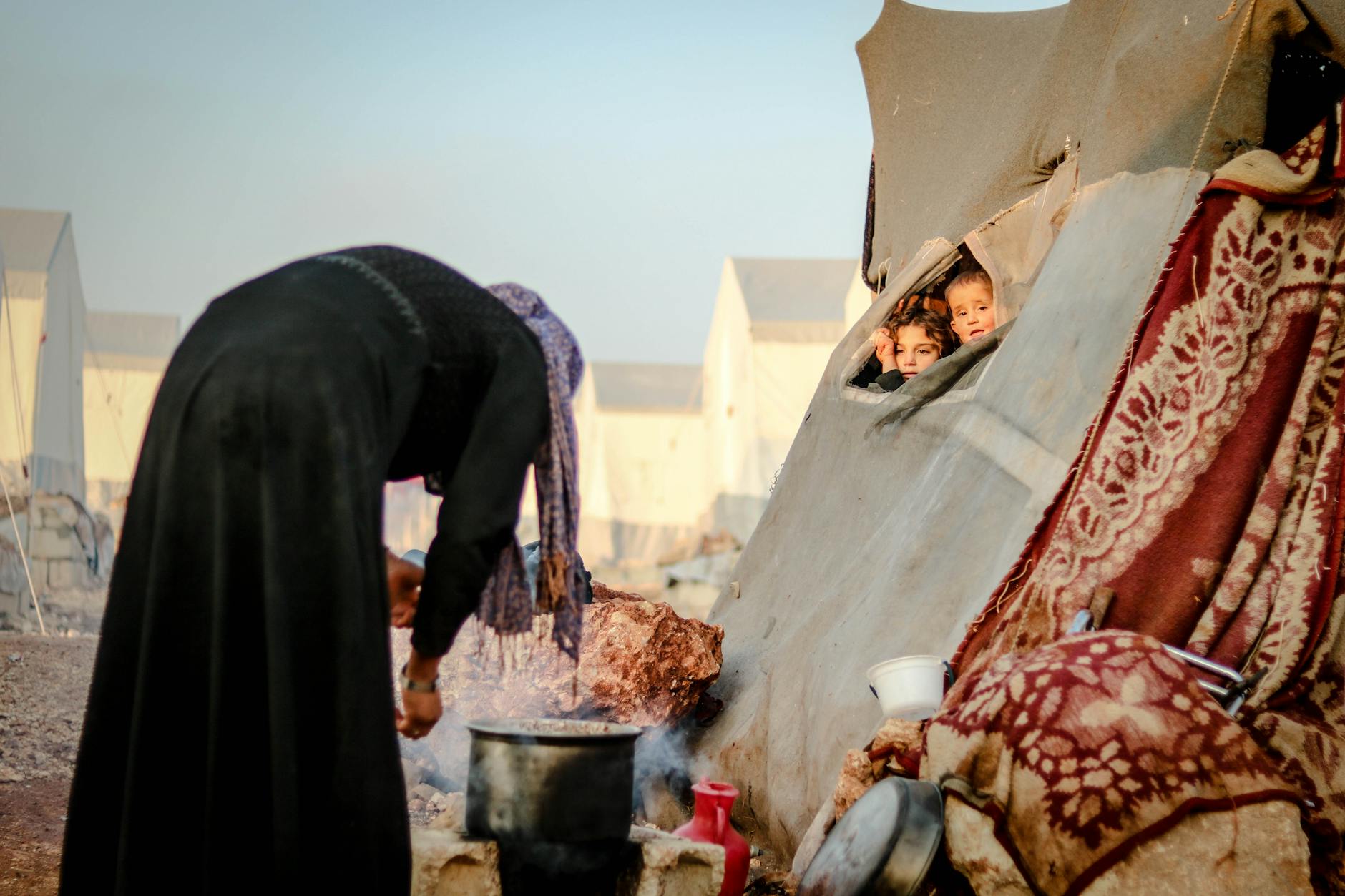 Temporary relief camp with tents housing displaced families affected by natural disaster