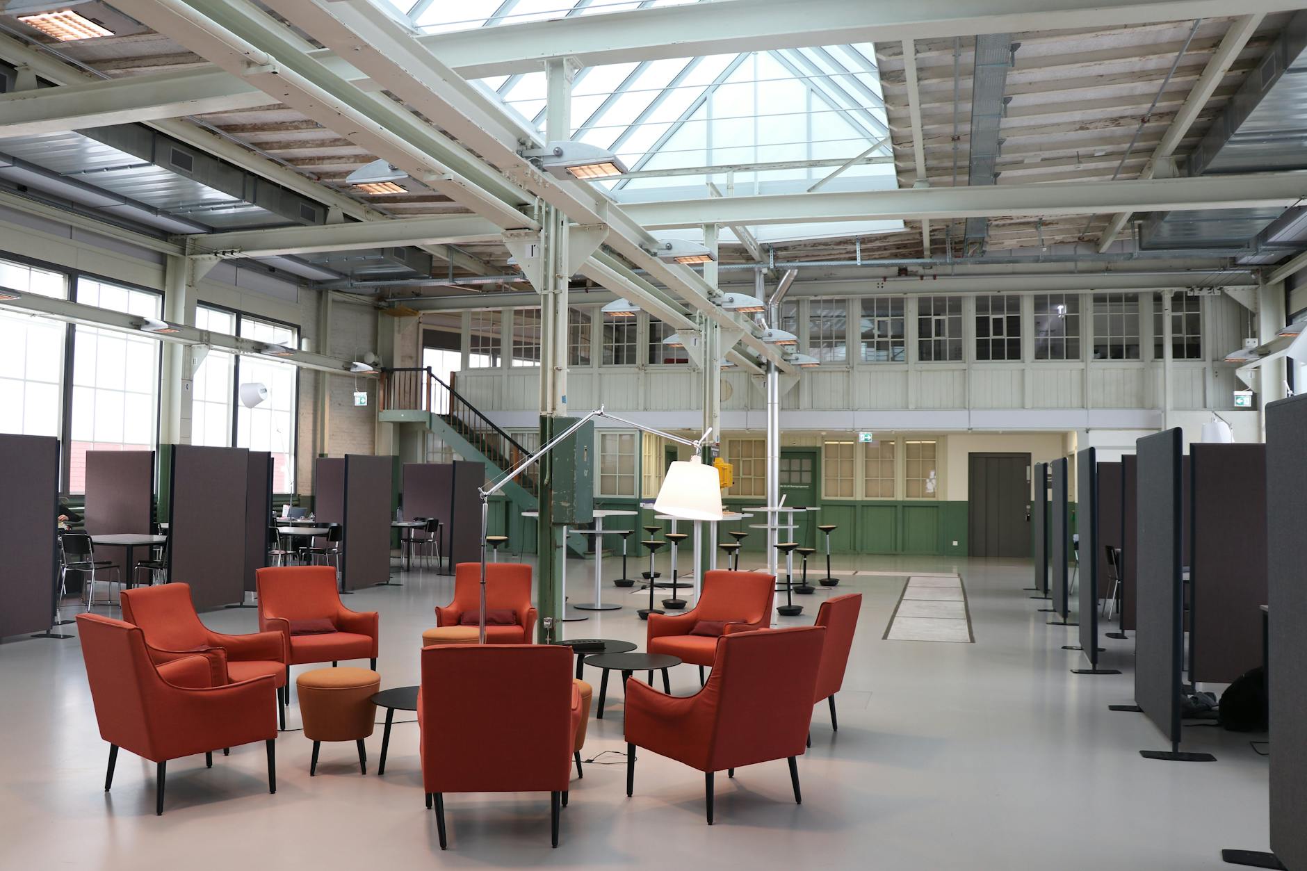 Modern coworking space interior with desks and technology setup for remote workers