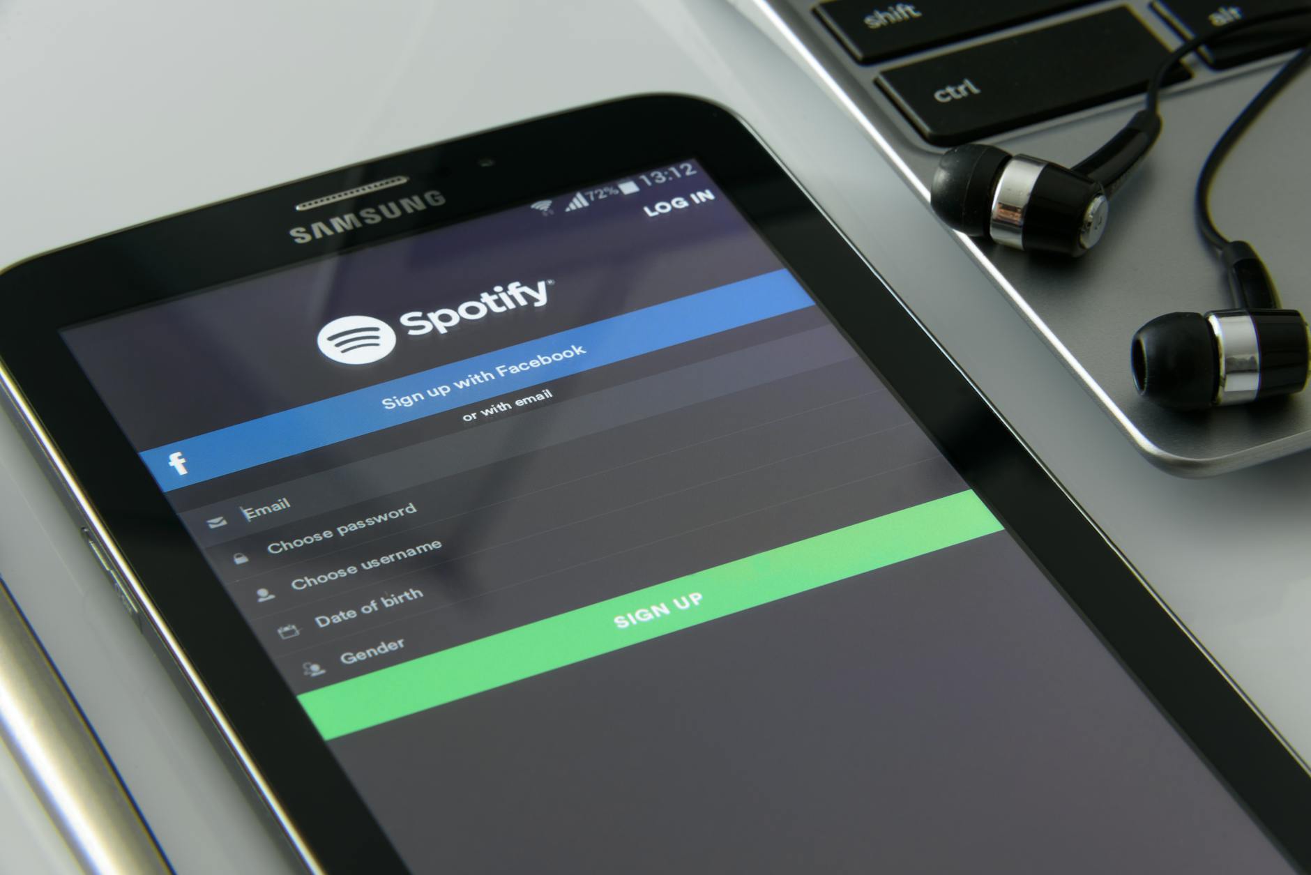 Person entering login credentials on smartphone screen for streaming service access