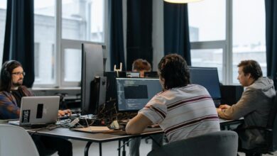Business professionals discussing strategy in a modern tech office setting