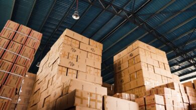 Large warehouse with shelves and logistics operations representing Amazon's marketplace infrastructure