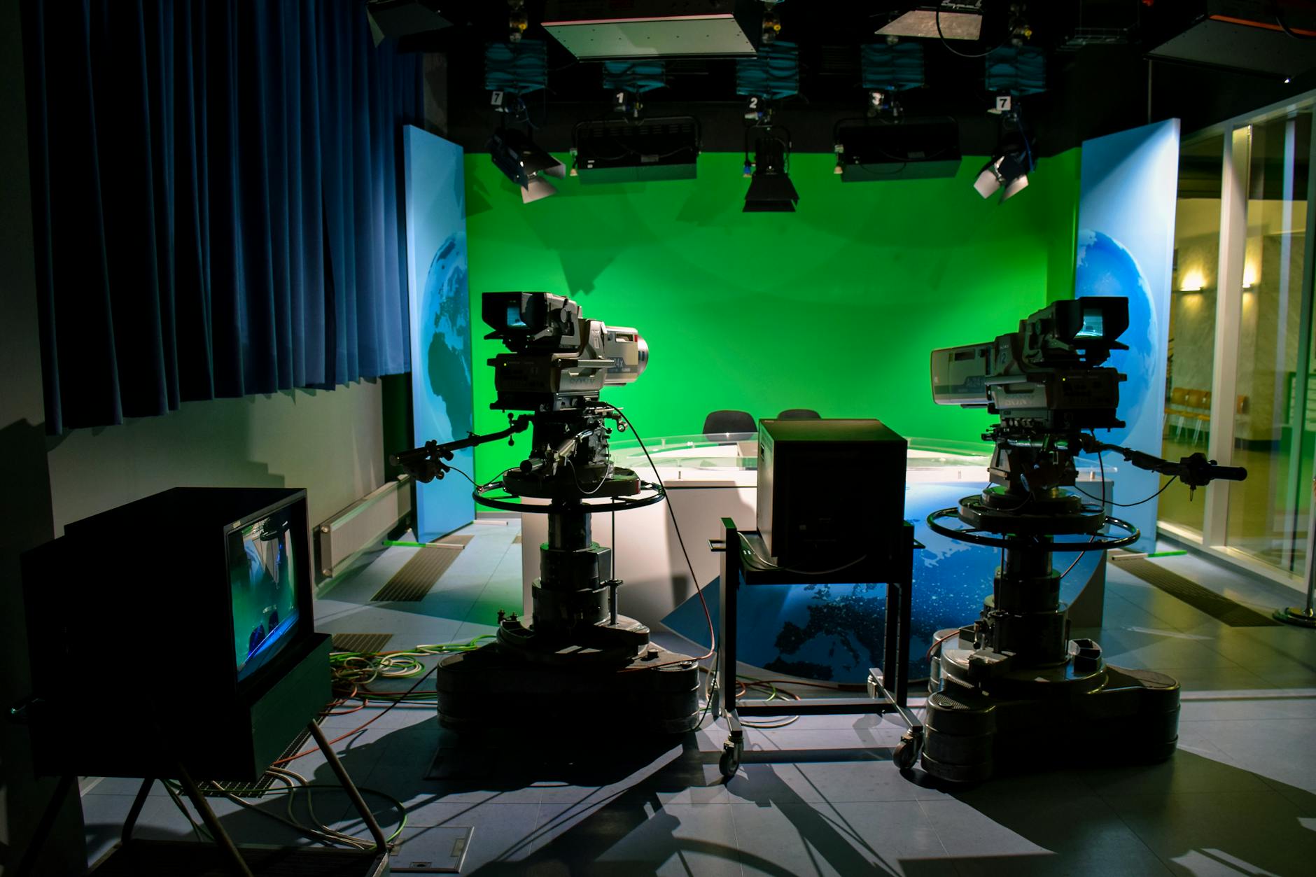Professional television news studio with cameras and broadcast equipment