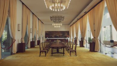 Two world leaders seated at a formal diplomatic table during a bilateral meeting