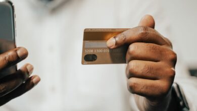 Person using smartphone for digital payment at retail checkout