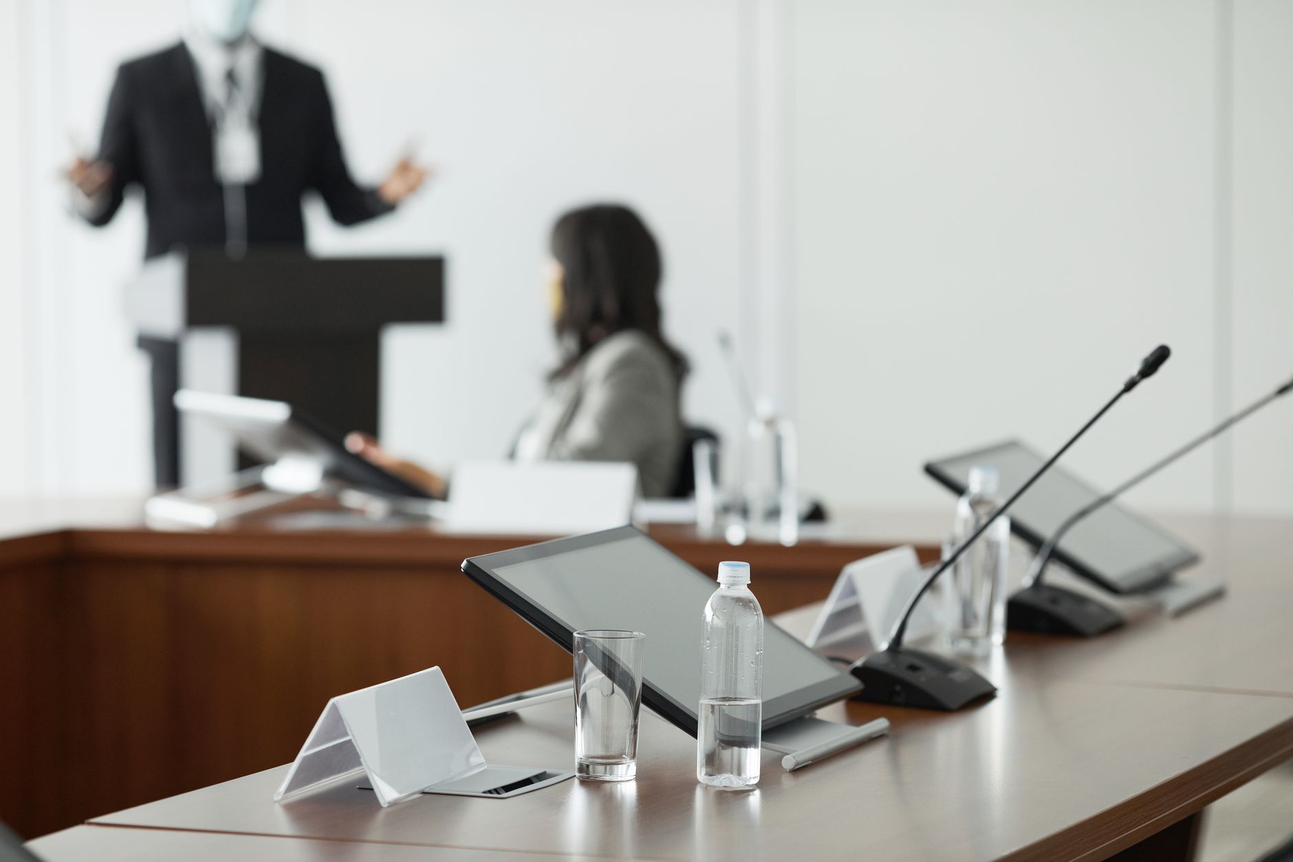 Empty corporate boardroom with chairs around a long table representing executive strategy meetings