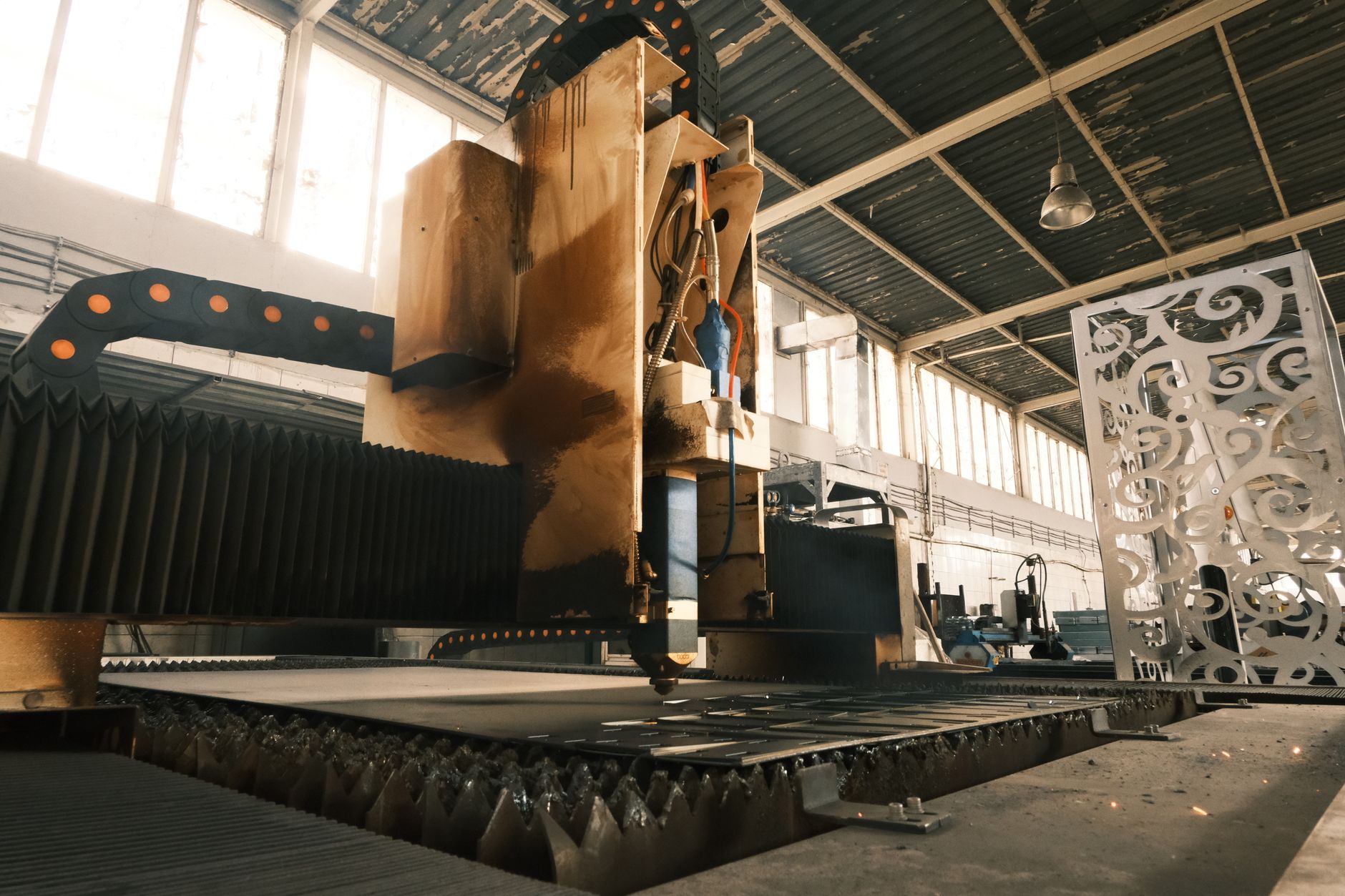 Workers on an automotive assembly line in a large manufacturing facility