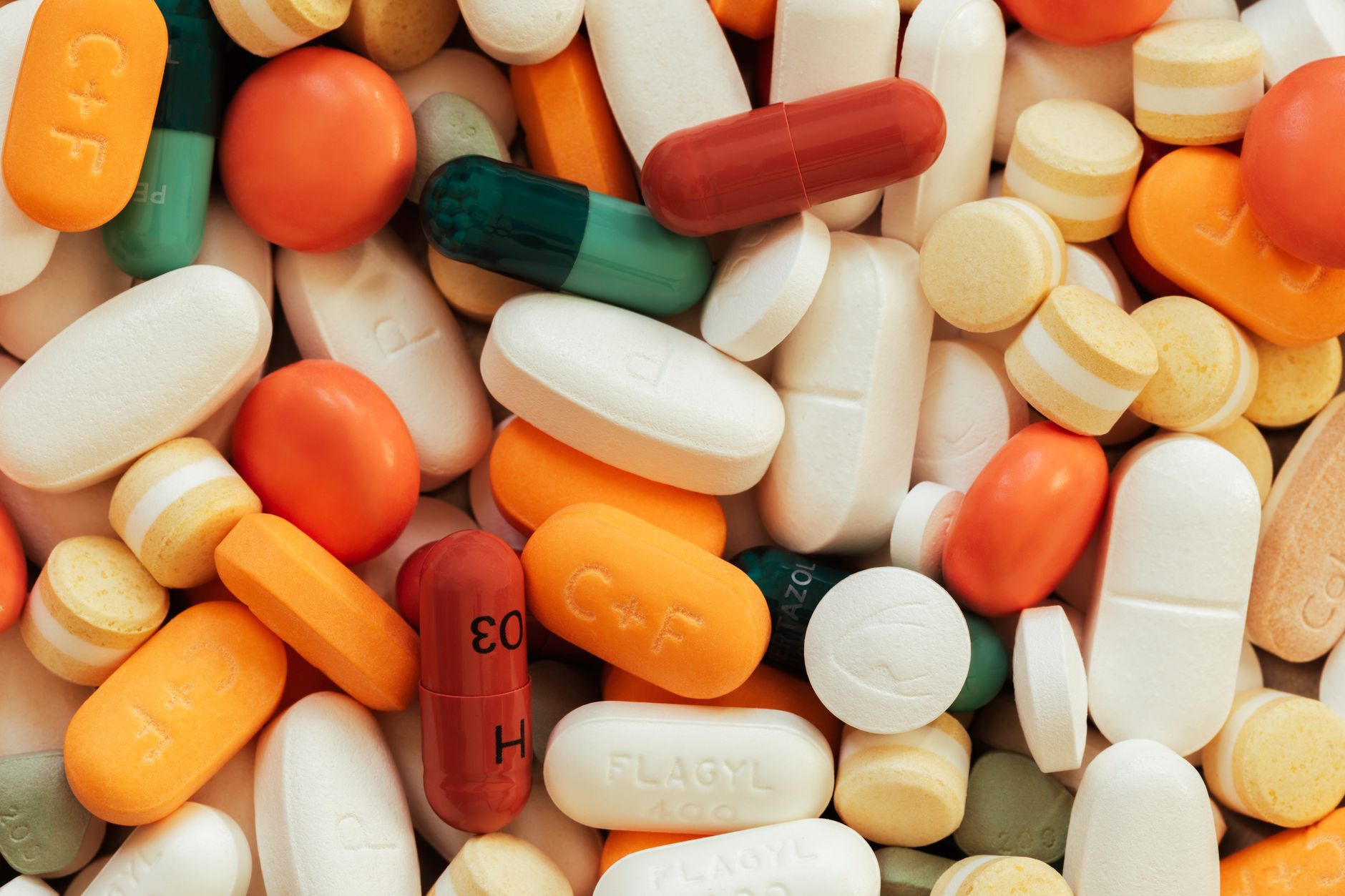 Close-up of prescription medication pills and capsules on a surface