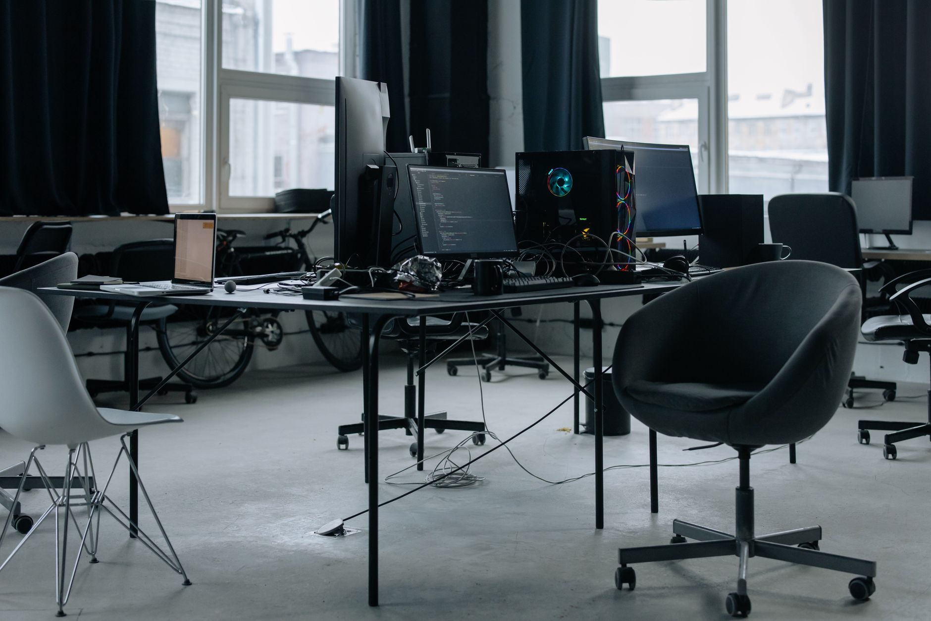 Engineers working at monitors inside a modern technology office