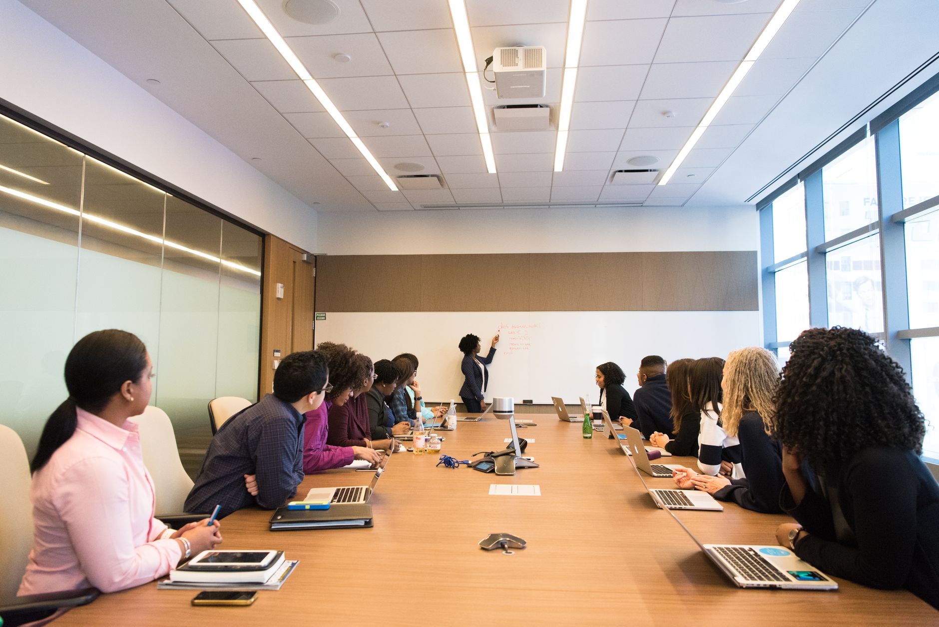 Business professionals reviewing technology strategy documents in a corporate setting