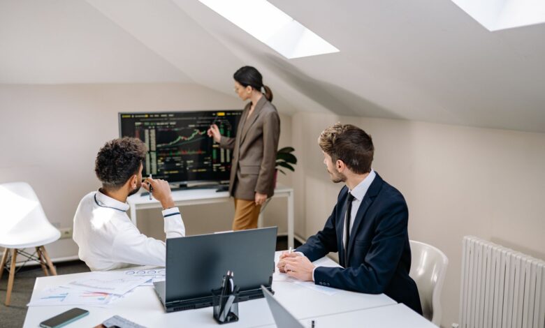 Corporate finance professionals working in a modern office environment representing institutional lending activity