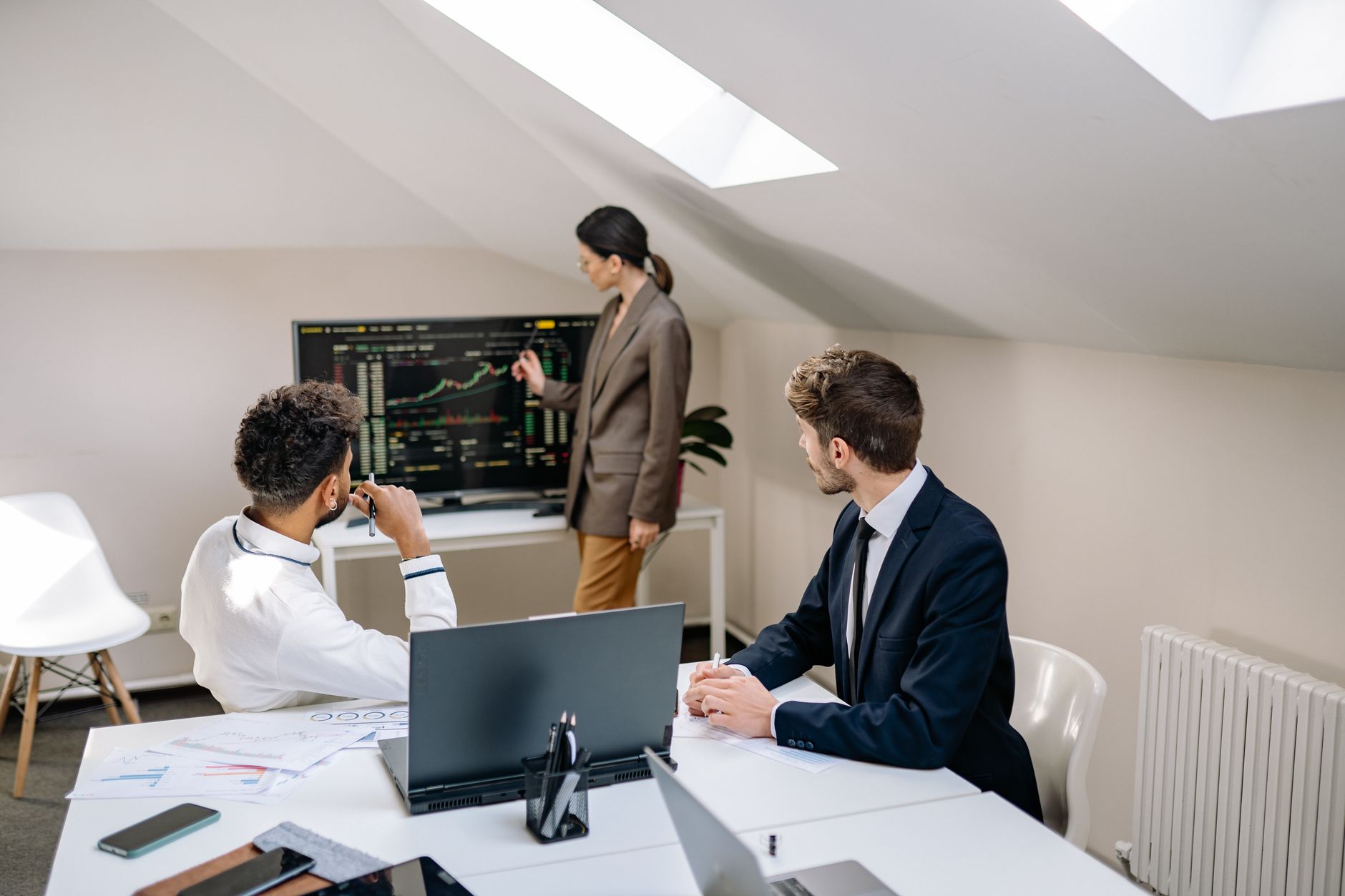 Corporate finance professionals working in a modern office environment representing institutional lending activity