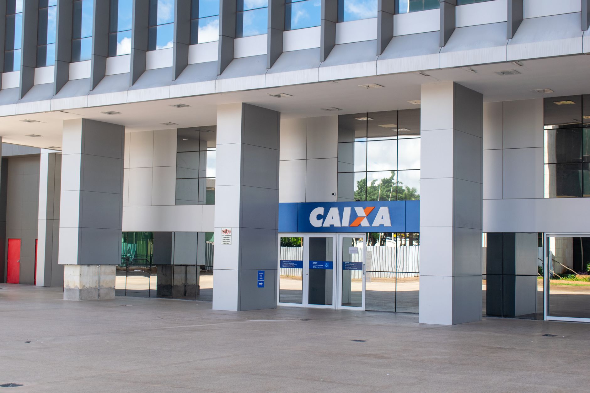 Modern bank branch interior with service counters and open floor plan