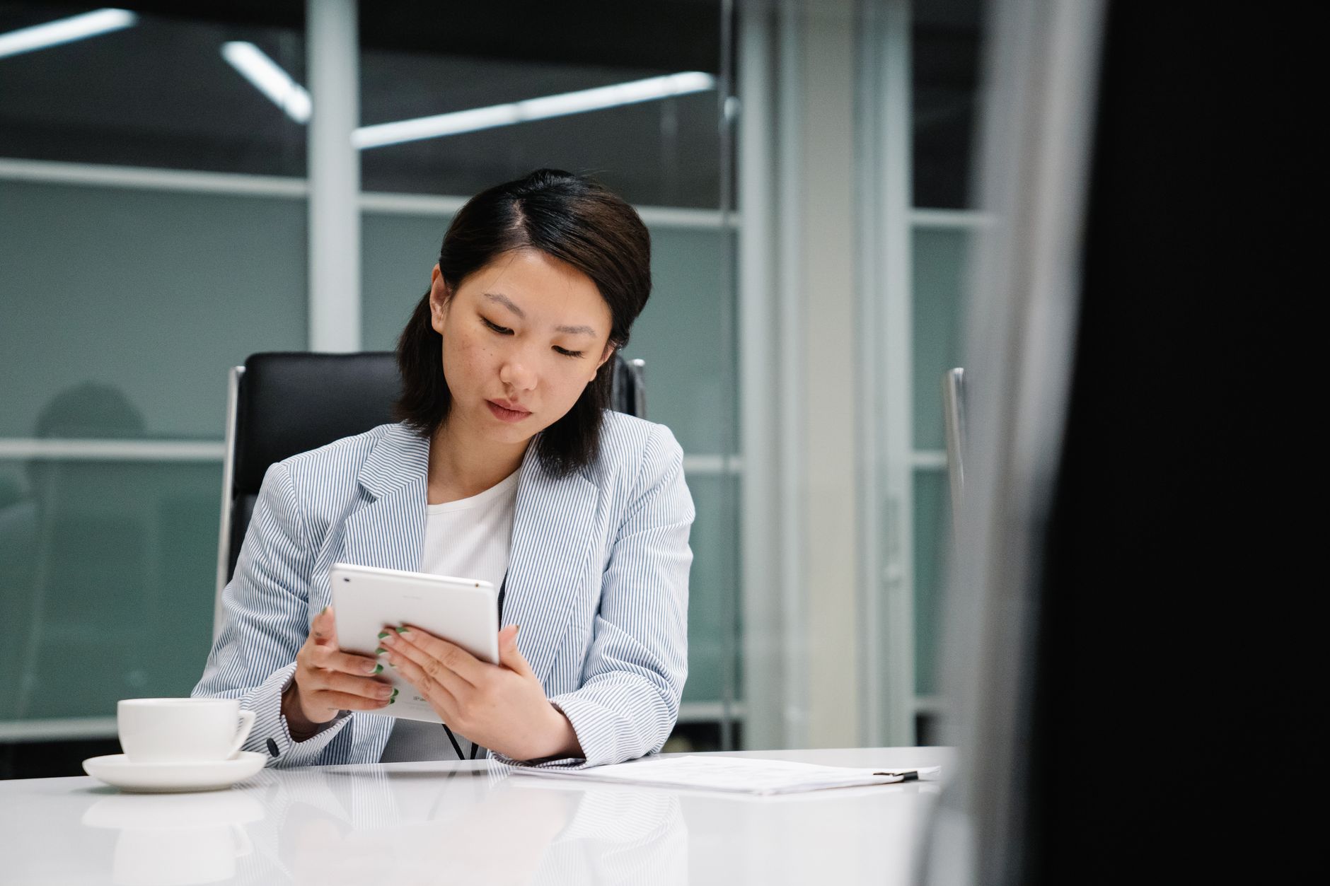 Modern corporate office with employees working on computers representing enterprise AI adoption