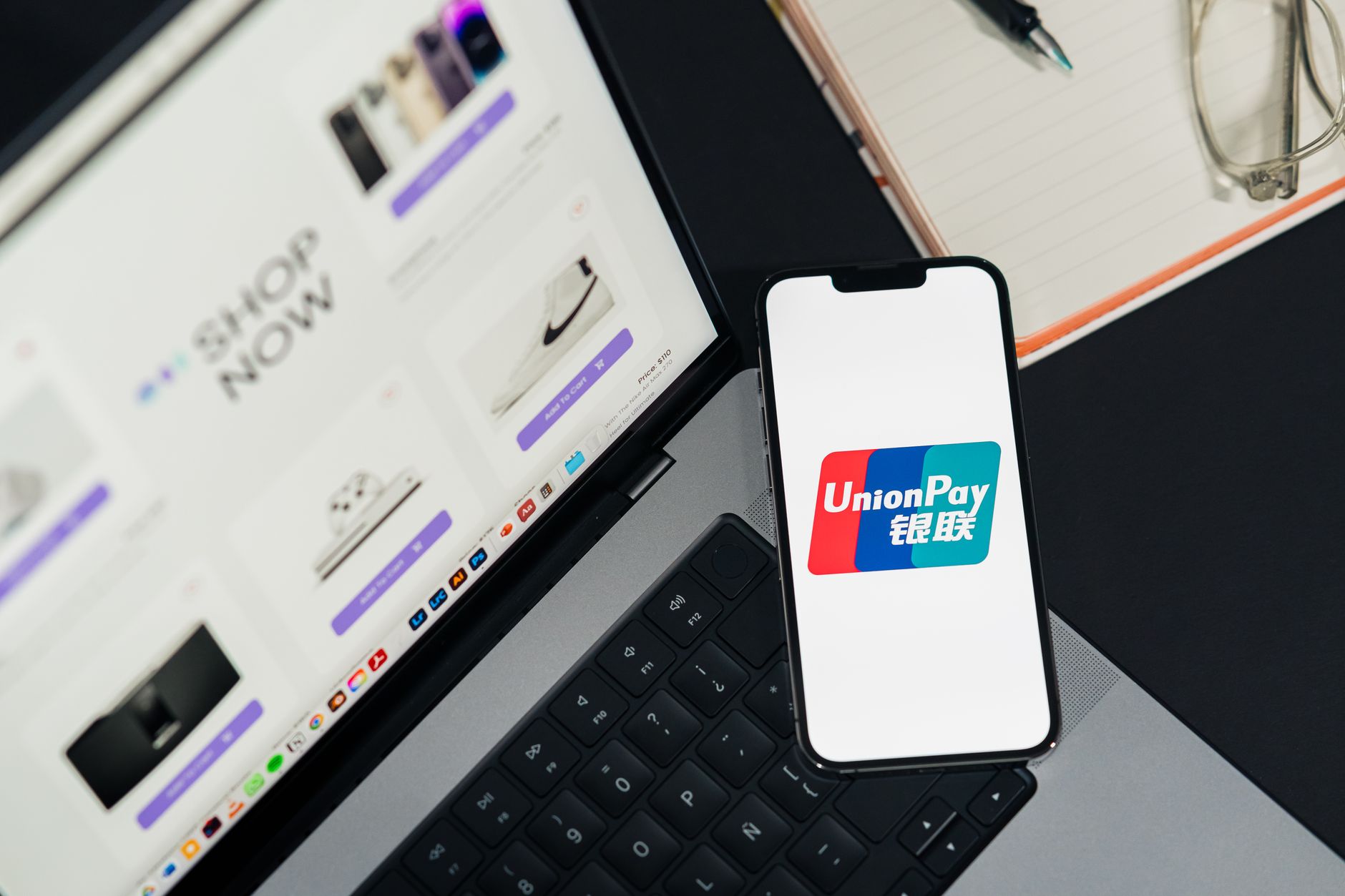 Person using smartphone for mobile payment at checkout counter