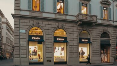 Elegant luxury fashion boutique interior with display cases and soft lighting