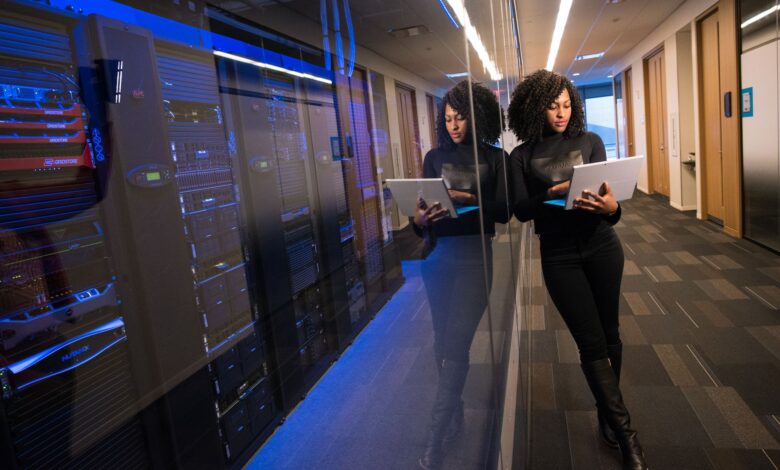 Rows of servers inside a large modern data center facility