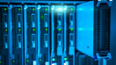 Dark server room with glowing rack lights representing cloud infrastructure