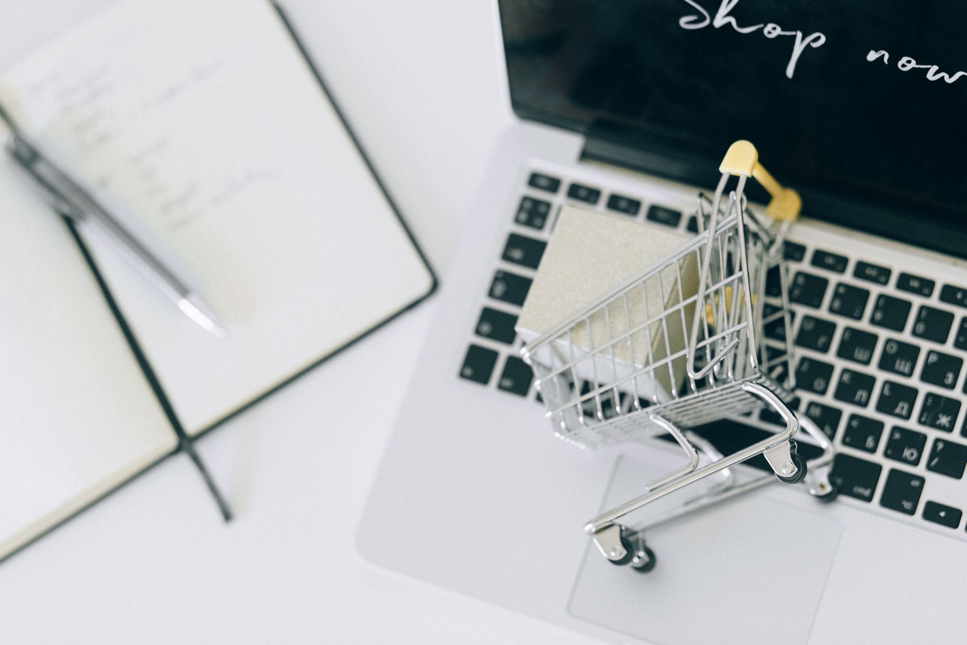 Person browsing an online shopping platform on a laptop, representing digital retail advertising