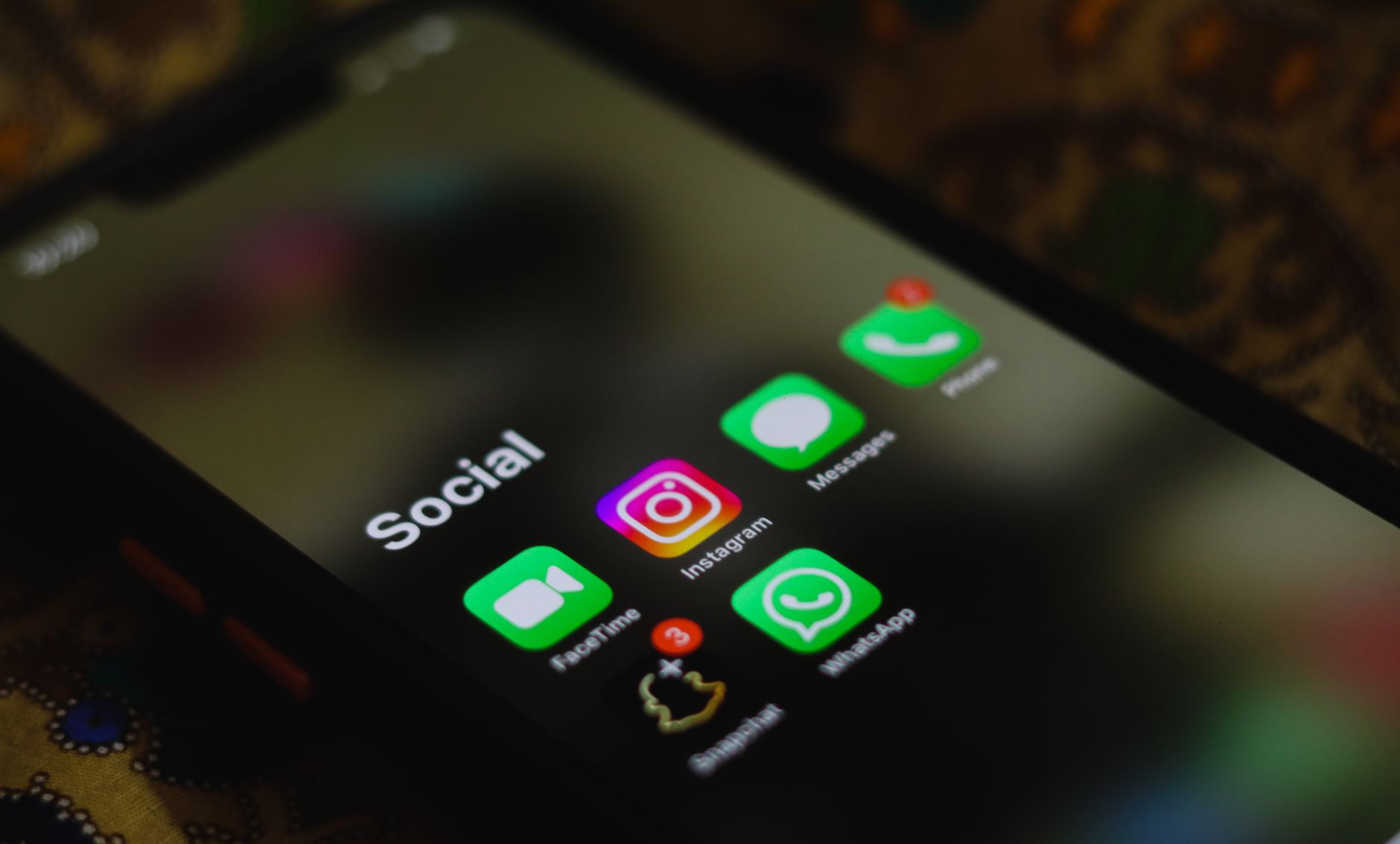 Person scrolling through a social media app on a smartphone