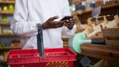 Person browsing a shopping app on a smartphone representing social commerce growth