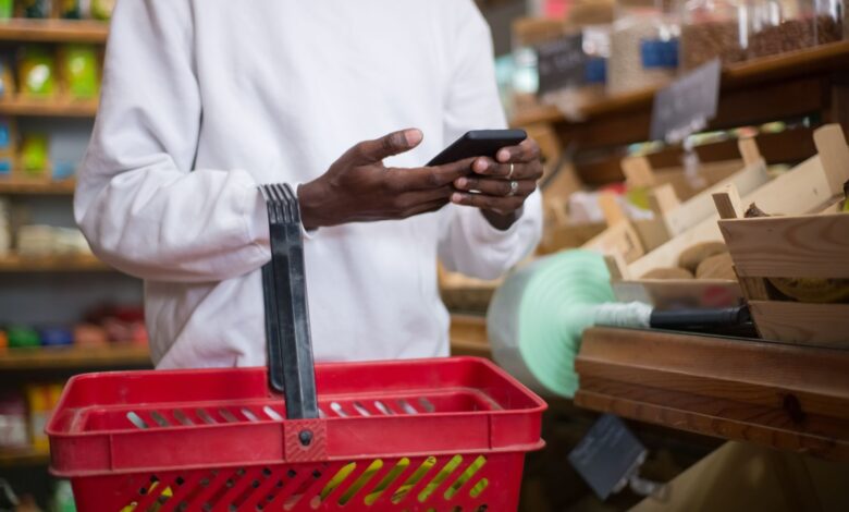 Person browsing a shopping app on a smartphone representing social commerce growth