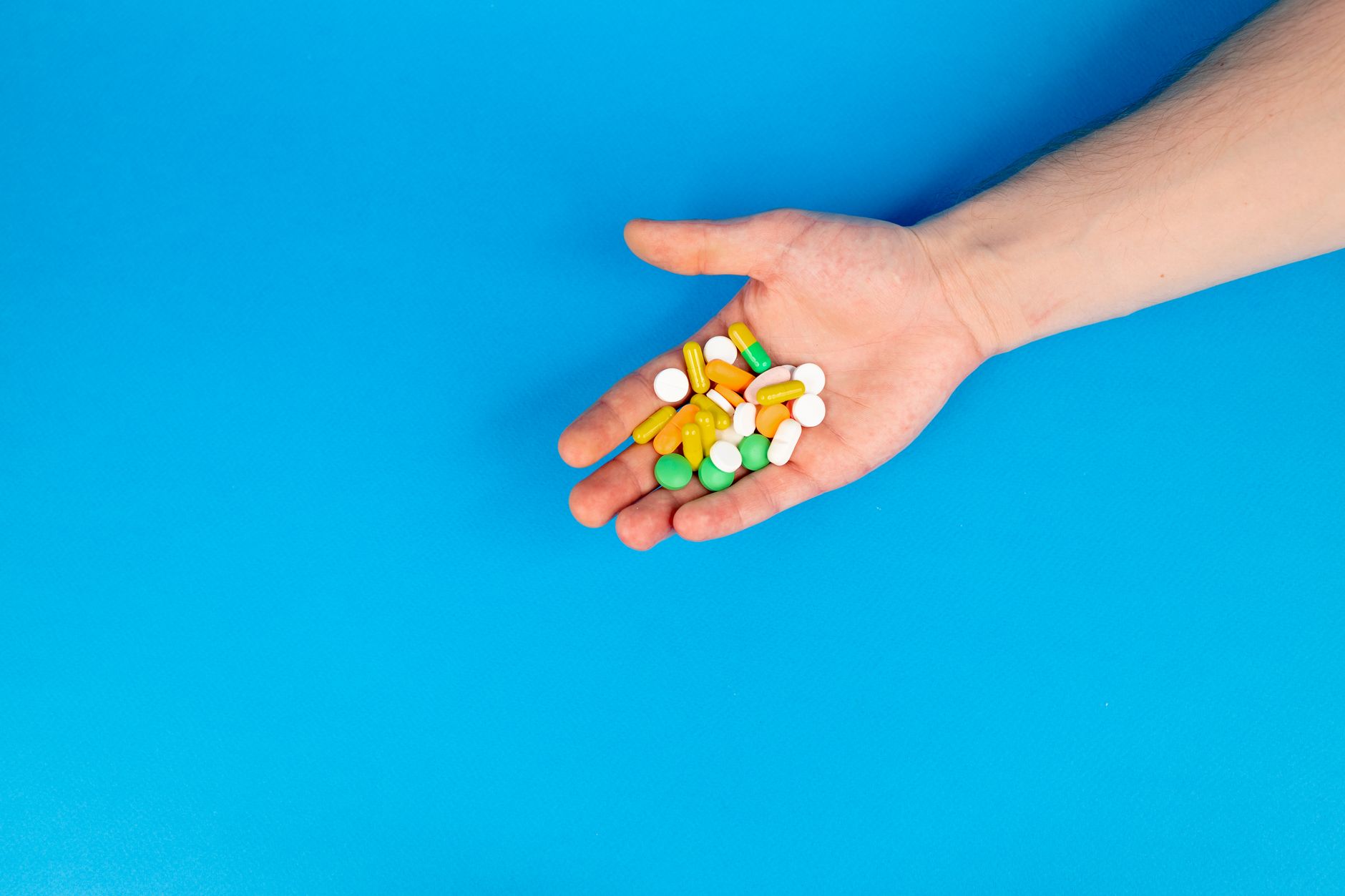 Close-up of prescription medication bottles on a pharmacy counter