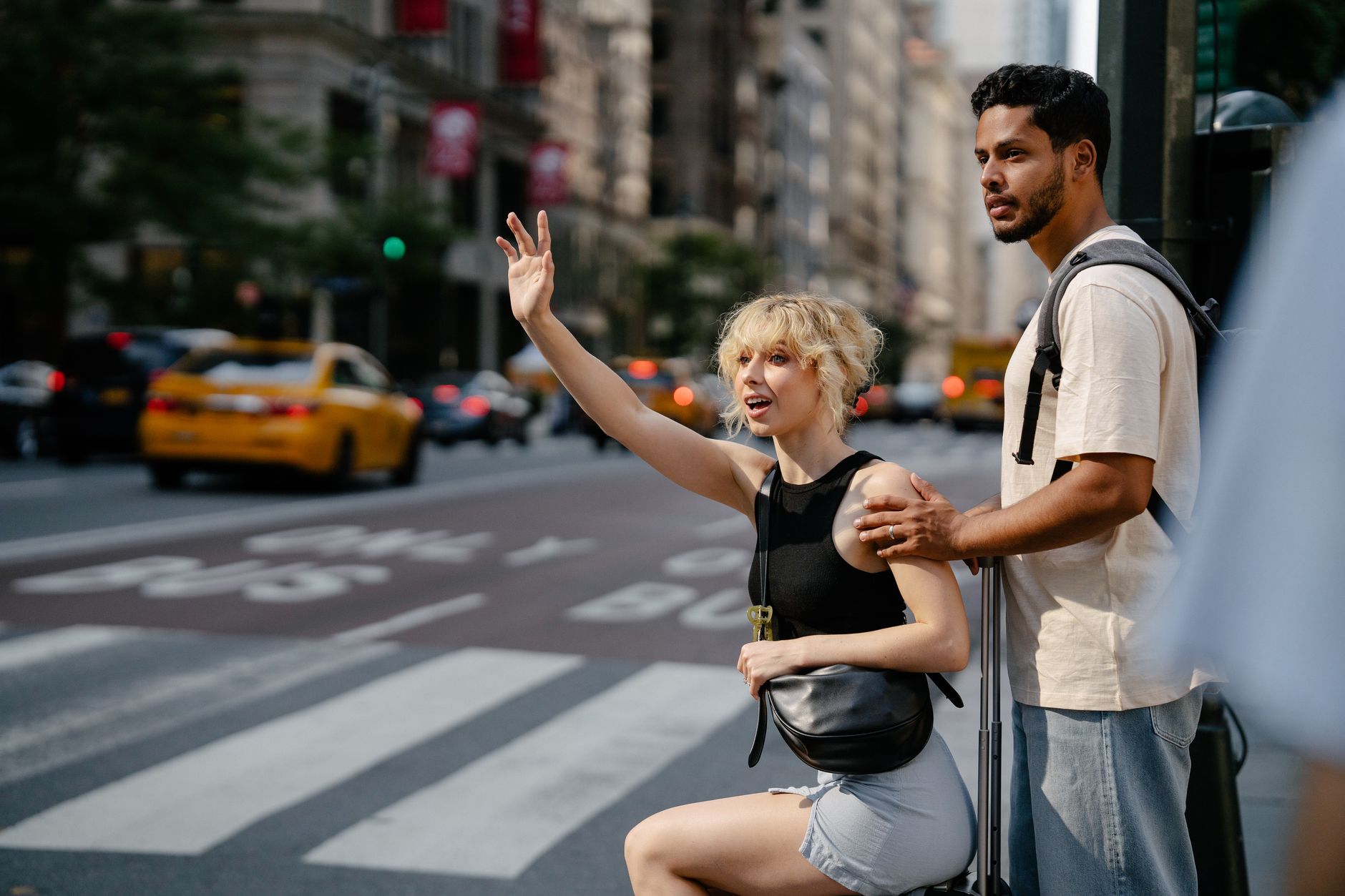 Smartphone displaying a ride-hailing app interface on a city street