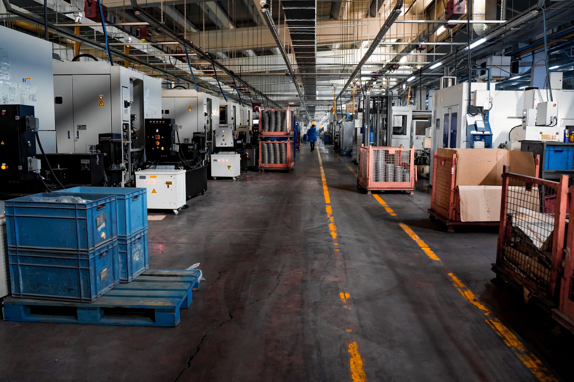 Workers on an automotive assembly line building vehicles