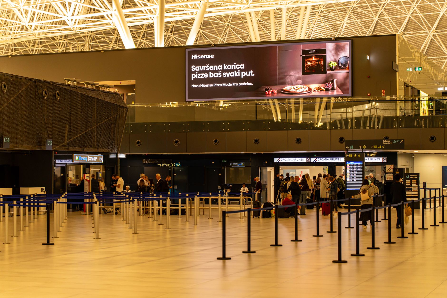 Digital advertising display showing branded content on a city screen
