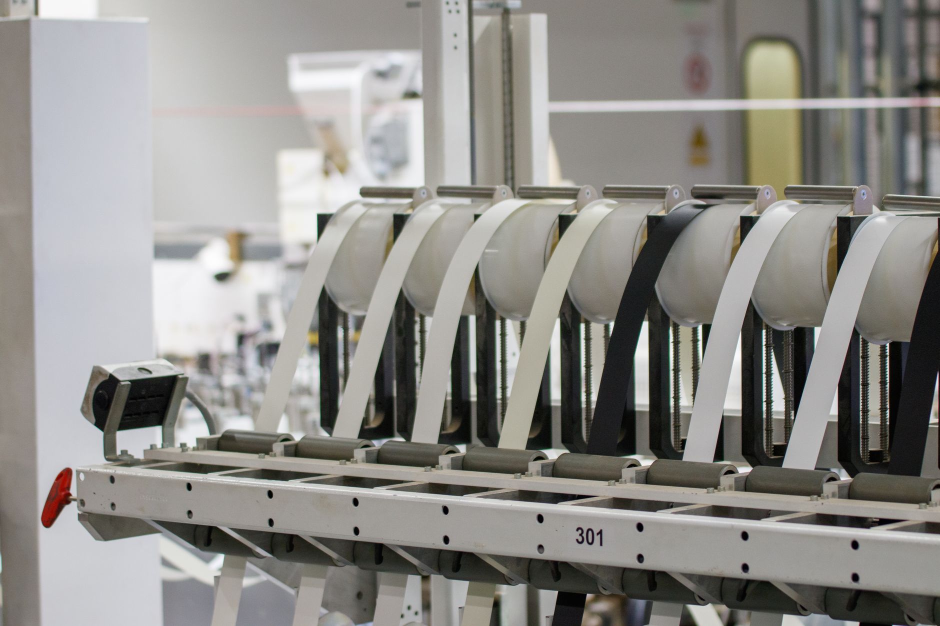 Workers on a modern electronics manufacturing assembly line