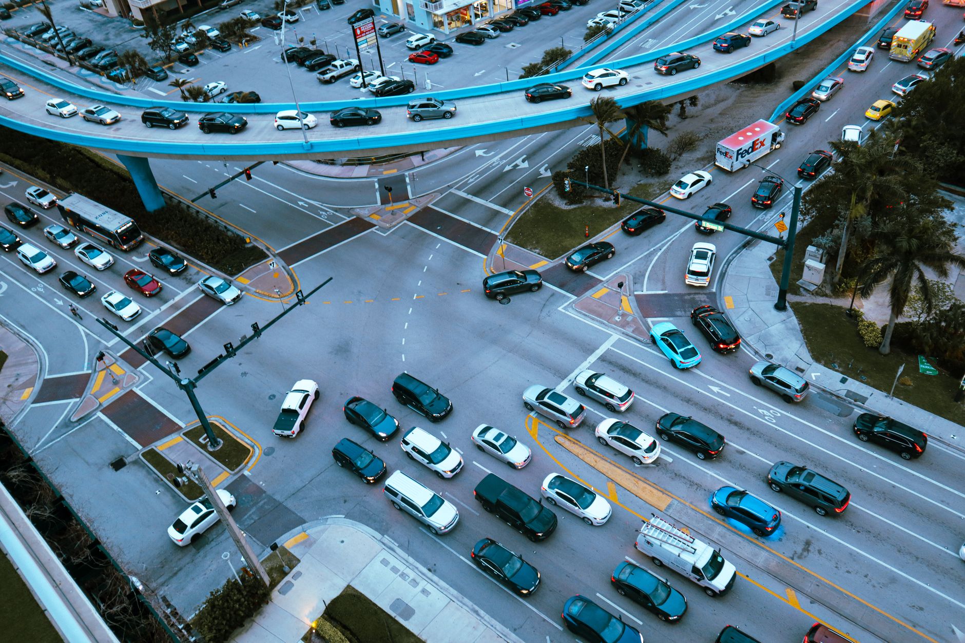 Aerial view of urban traffic and city streets where autonomous vehicles operate