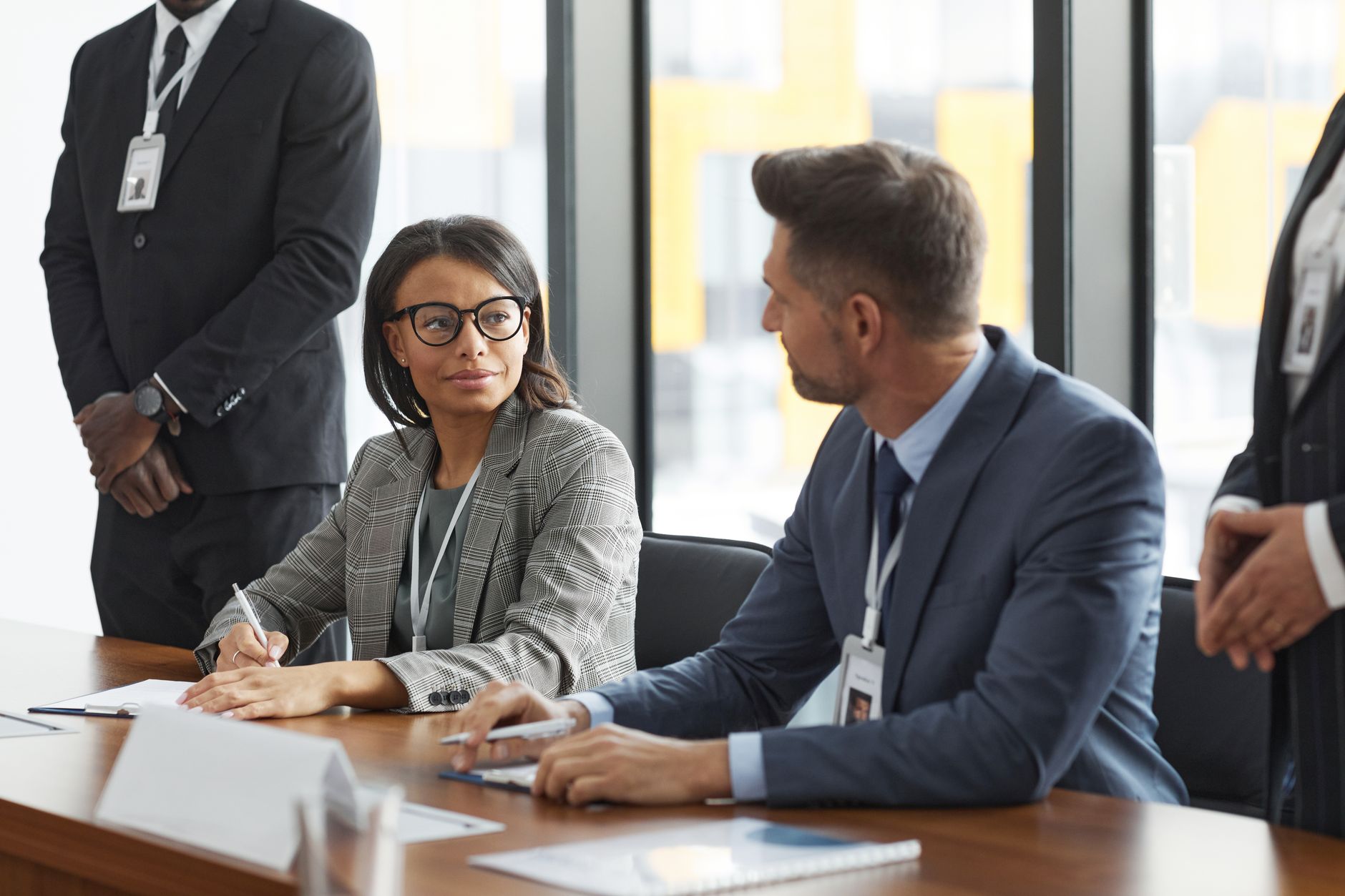 Business professionals reviewing contracts representing European energy procurement decisions