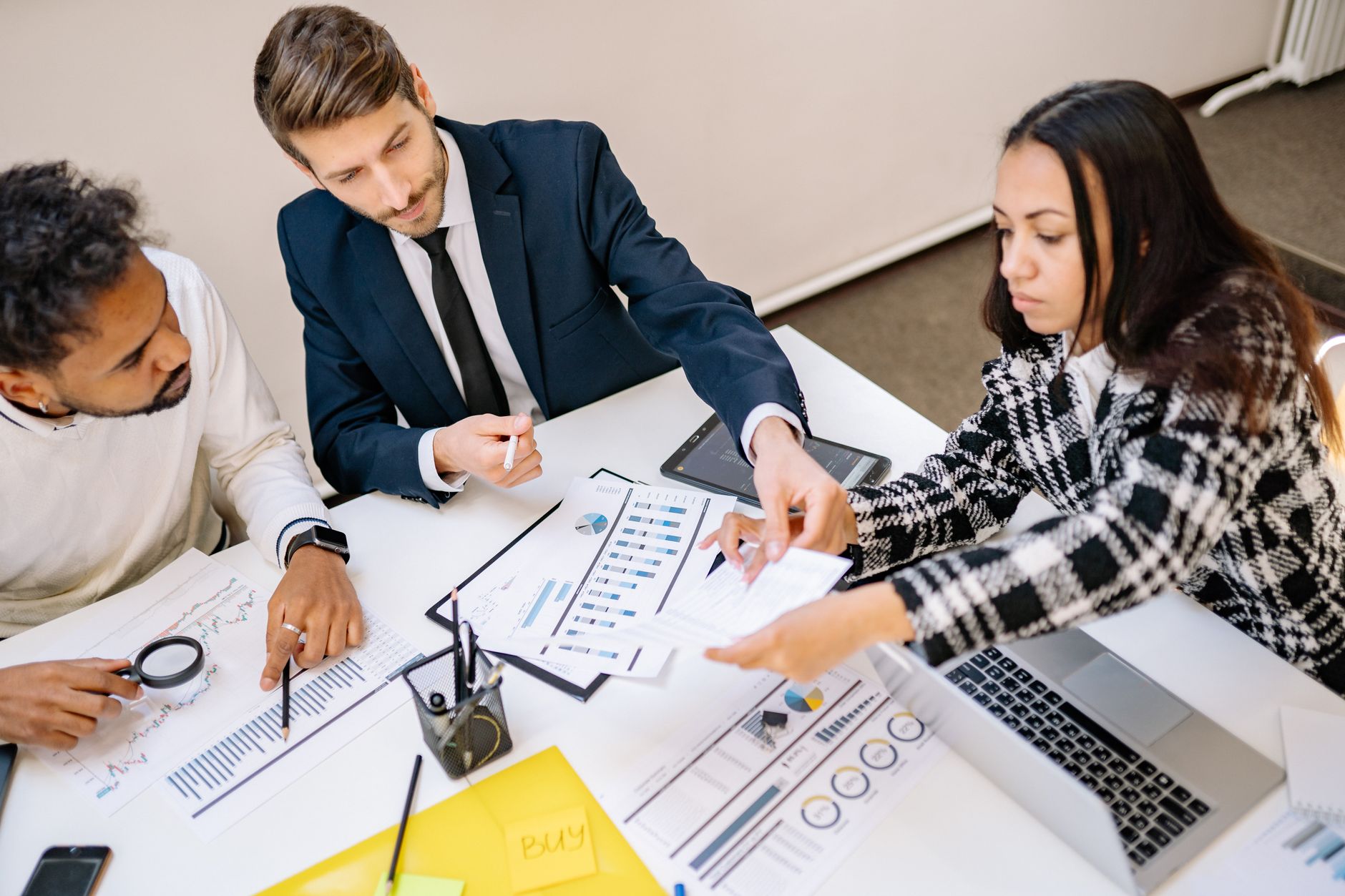 Business professionals reviewing documents during a strategy meeting